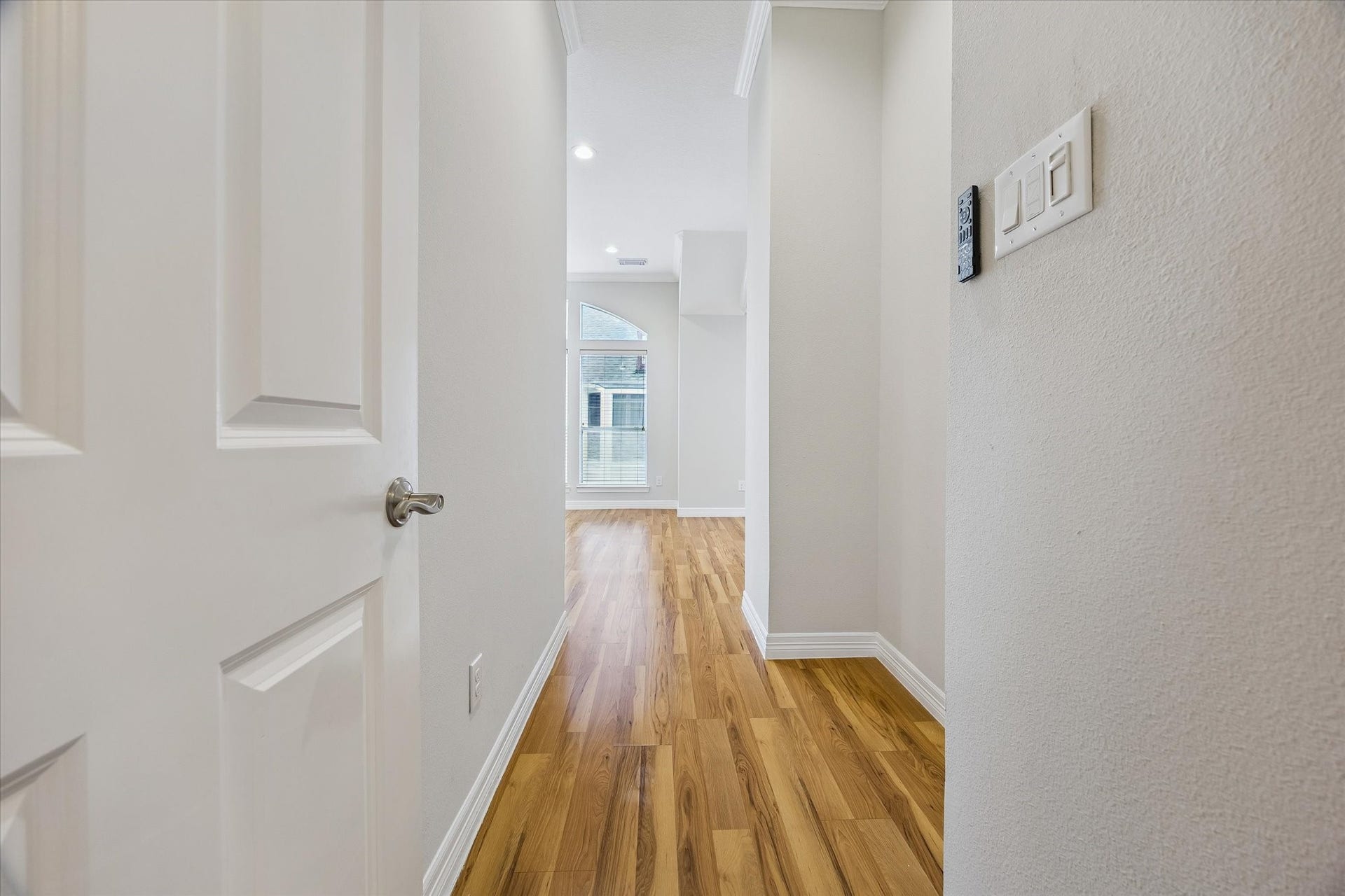 Moving to the third floor, the primary even has its own little entry hallway. Niche in wall could be great spot for a console to drop off everyday items or maybe a bookshelf for your personal library or collectibles!