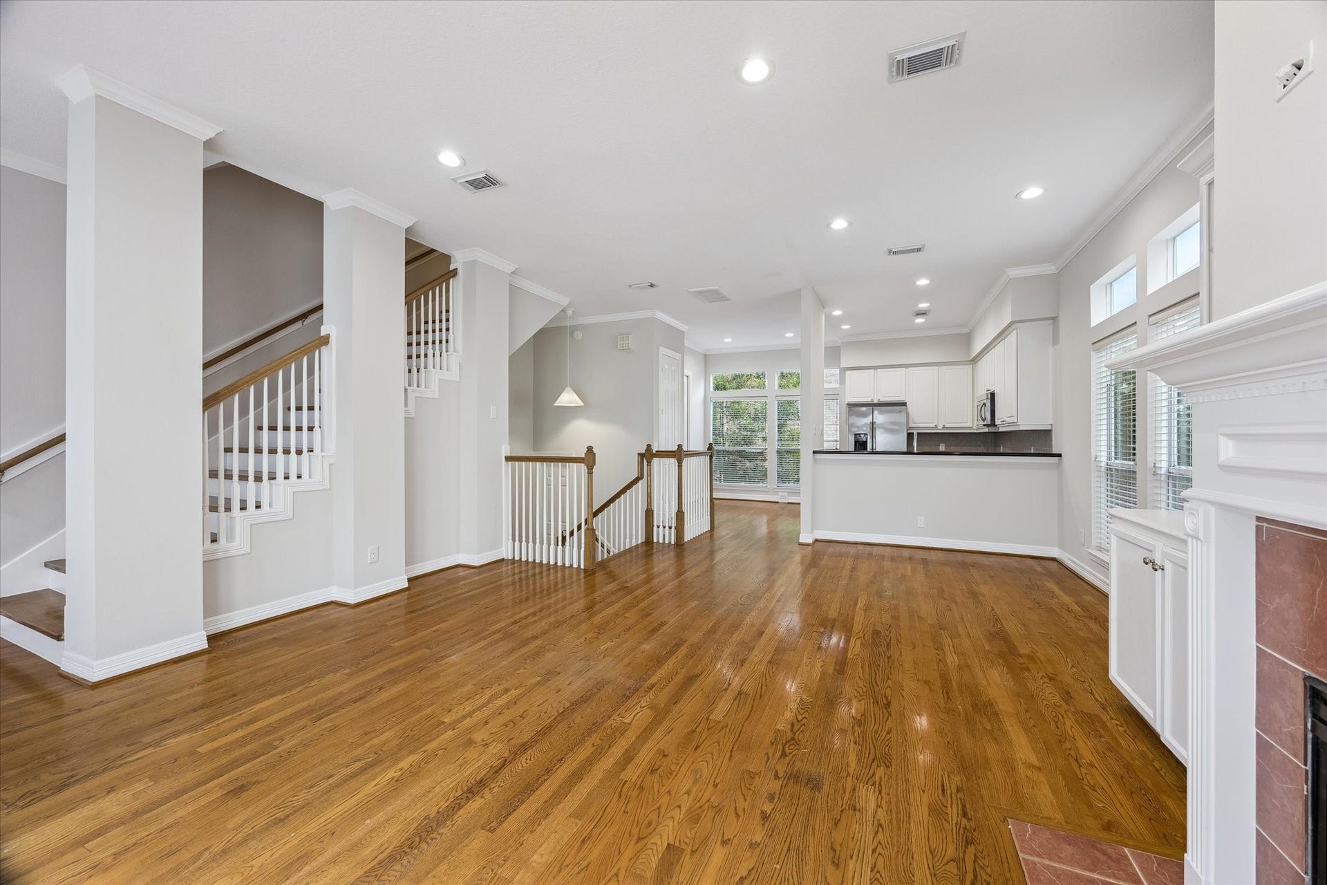 Staircase leading to third floor is also partially open to living floor, keeping everything light & airy!