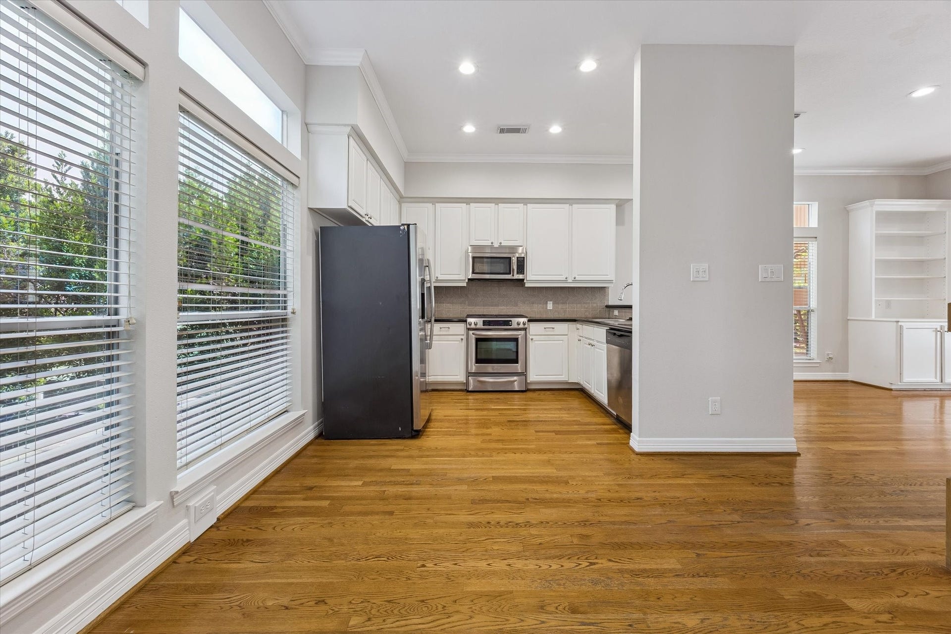 Open space adjoining kitchen is perfect for a breakfast / informal meals spot!