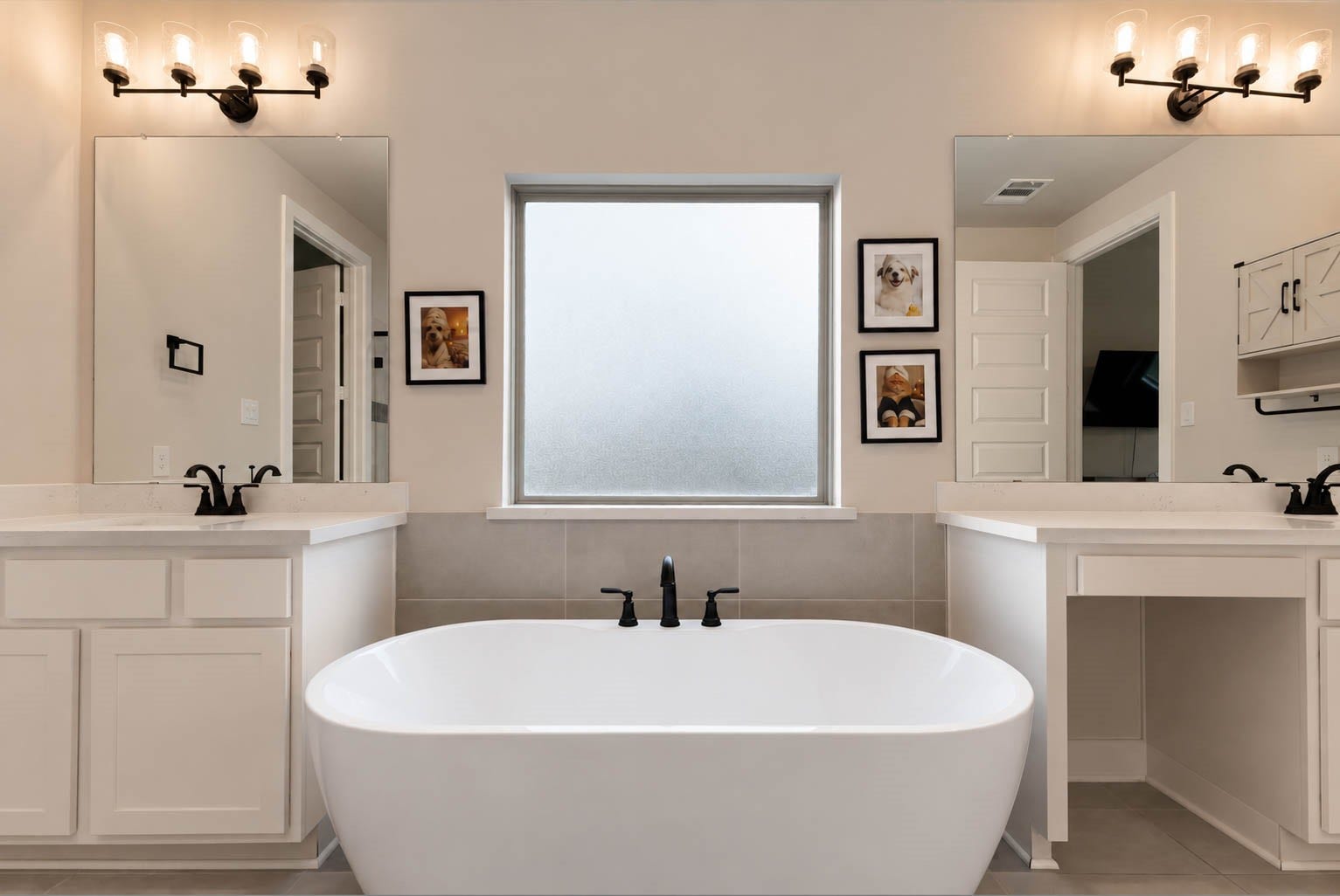 3165 Stingray Cove Drive, Katy, TX 77493 This alternate view beautifully showcases the oversized soaking tub as the centerpiece of the primary bath, elegantly positioned between the dual vanities. One vanity extends to provide generous counter space and a dedicated seated grooming area, adding both luxury and everyday functionality to this spa-inspired retreat.