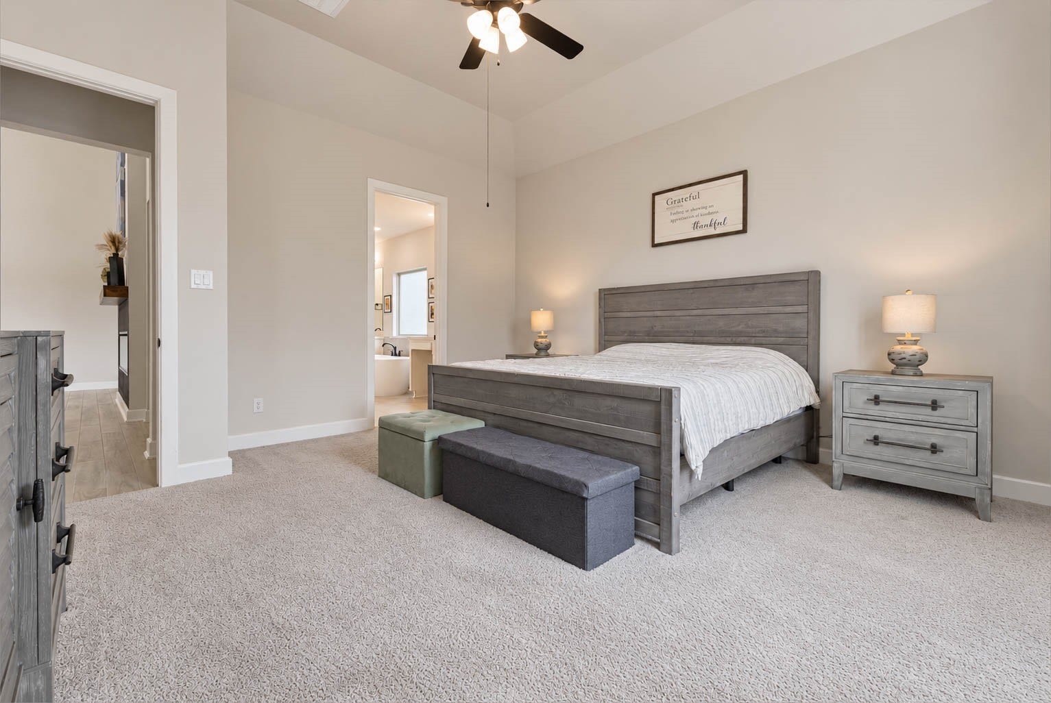 3165 Stingray Cove Drive, Katy, TX 77493 Another view showcases the exceptional scale of the primary suite and its seamless connection to the ensuite bath. The elevated ceiling, neutral palette, and expansive floor space create a serene setting with room to comfortably incorporate additional seating or furnishings.
