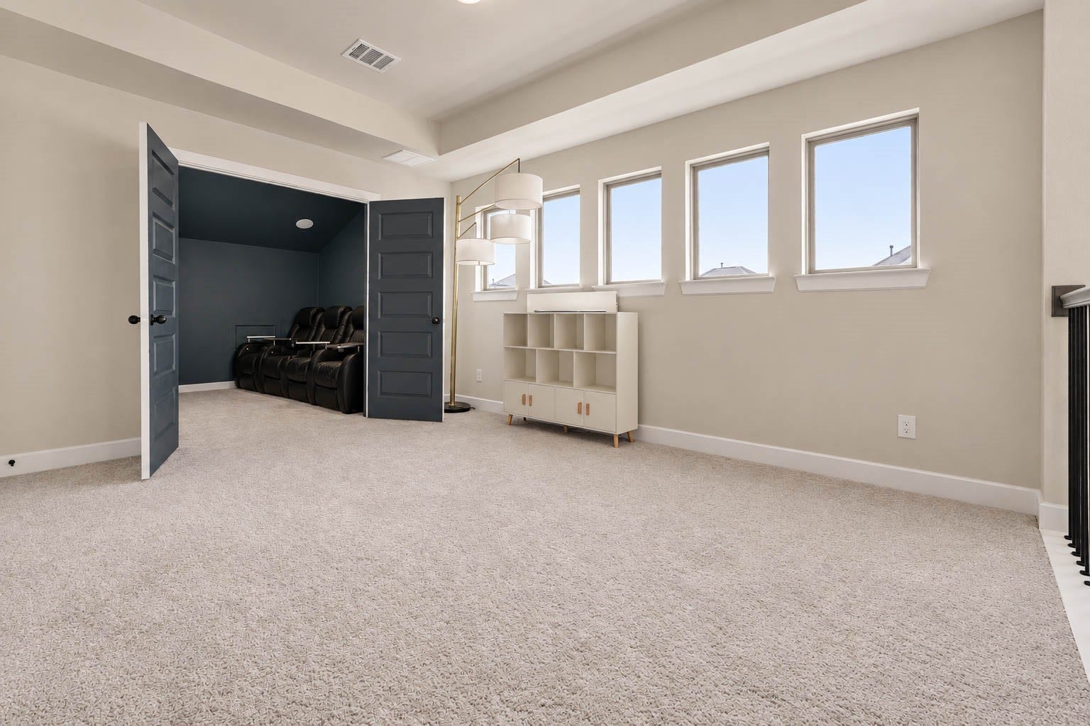 3165 Stingray Cove Drive, Katy, TX 77493 The expansive upstairs game room offers an impressive amount of space for relaxing, entertaining, or creating a secondary living area. Double doors open directly to the dedicated media room for an effortless transition between gathering and movie spaces.
