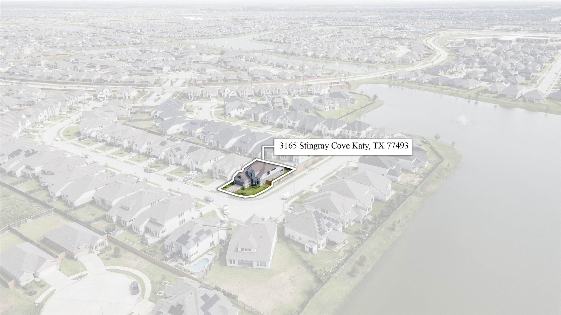 3165 Stingray Cove Drive, Katy, TX 77493 A birds-eye introduction to 3165 Stingray Cove Drive, ideally situated within Sunterras thoughtfully planned residential setting. This perspective highlights the homes placement within the neighborhood and the attractive streetscape surrounding it.