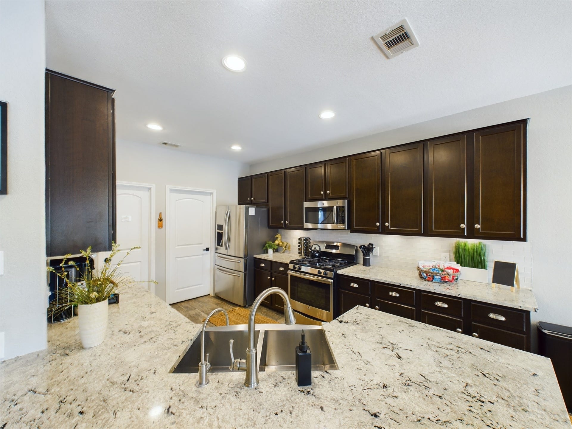 Full Size Utility Room and Walk-in Pantry off the Kitchen