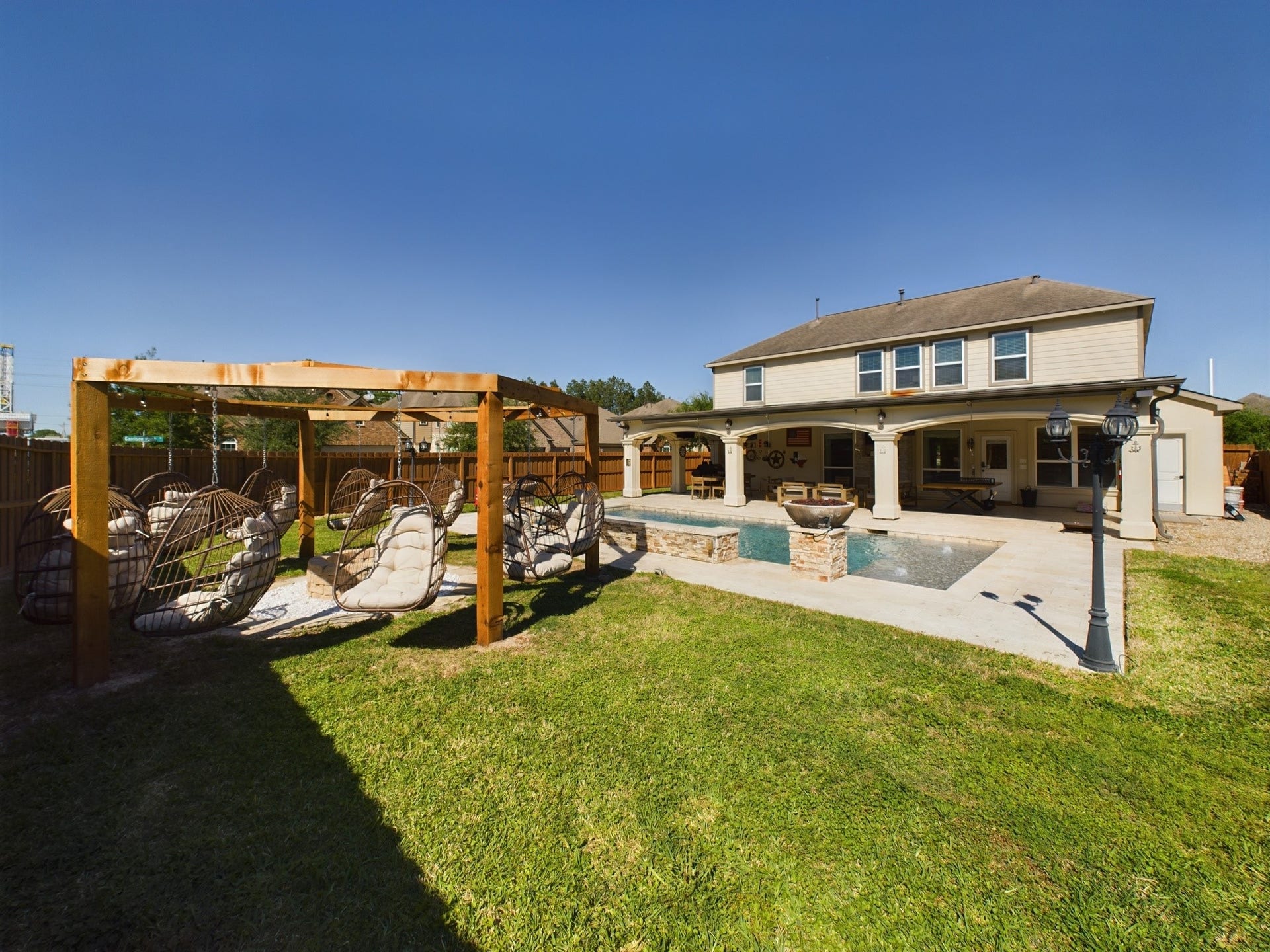 Travertine Decking, Ceiling Fans, Recessed Lighting, TV's and Exterior Gas Connection