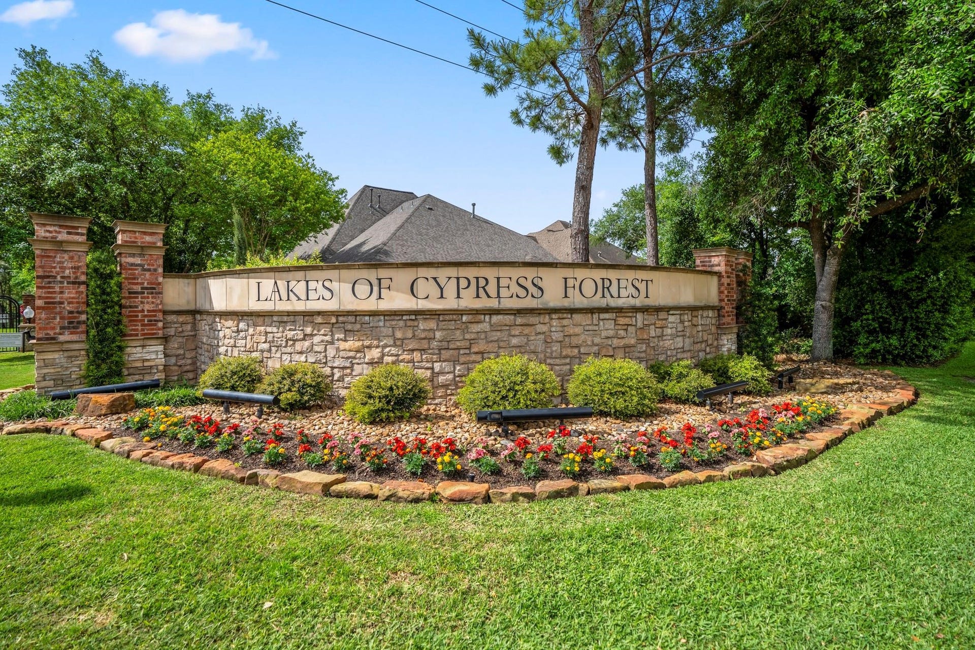 2407 Hendricks Lakes Drive, Spring, TX 77388 Lakes of Cypress Forest welcomes you with manicured landscaping, brick-and-stone signage, and an established gated-community feel before the neighborhood opens into its lakes, walking paths, fountains, pool, clubhouse, and outdoor amenities. Its the kind of setting that makes the water-front lifestyle feel connected from the moment you arrive.