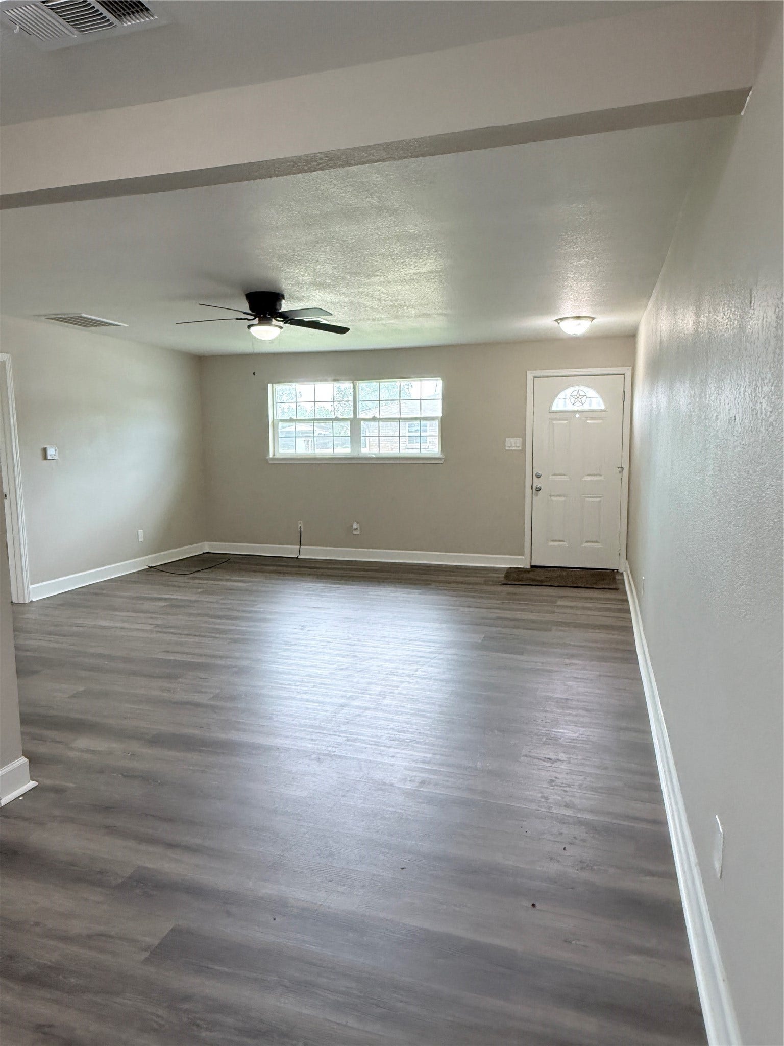 608 County Road 157, Alvin, TX 77511 From the laundryroom angled at toward the front door. All windows have been upgraded.