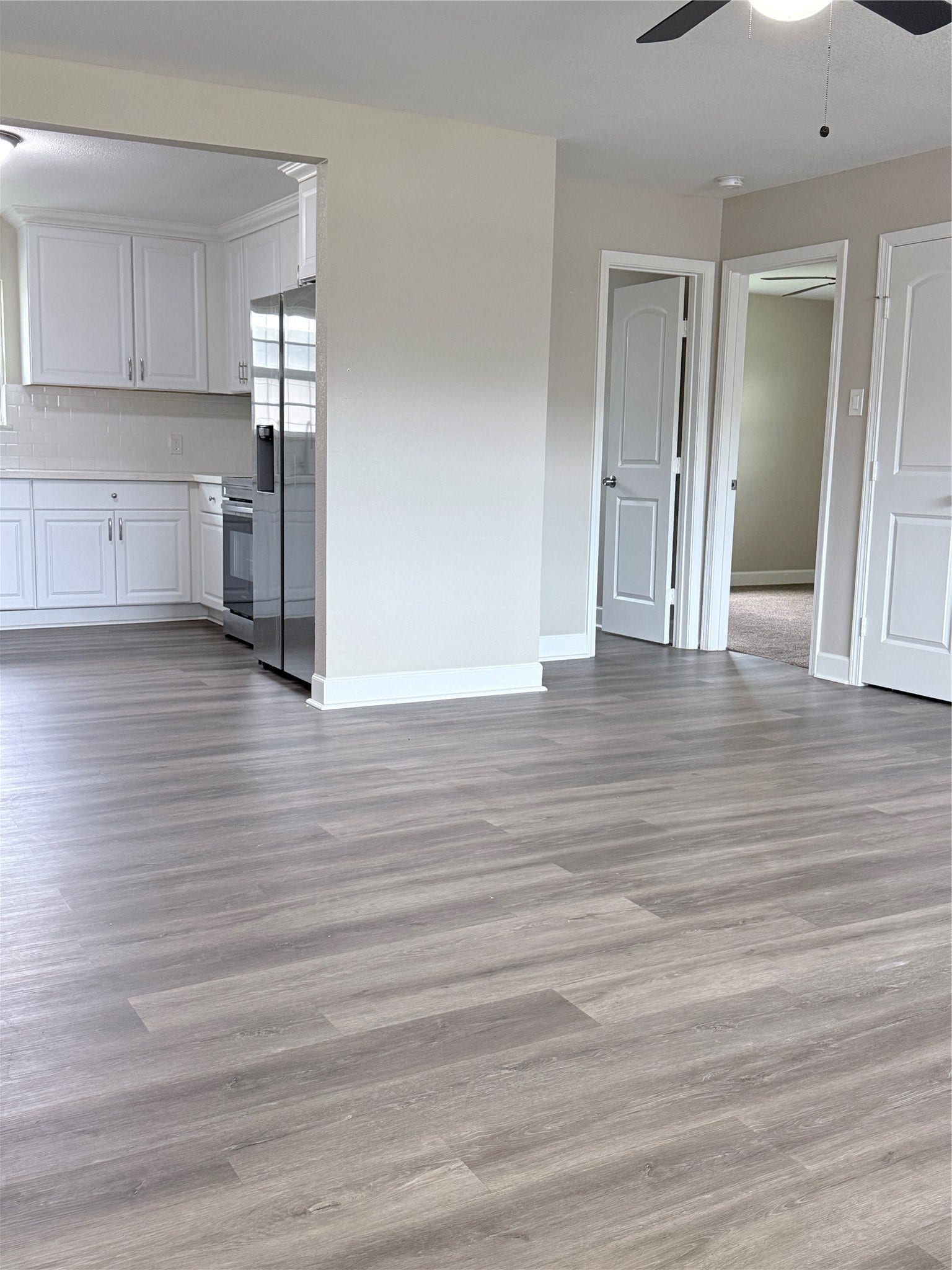 608 County Road 157, Alvin, TX 77511 Enjoy a spacious and inviting atmosphere with a seamless flow from the living room to the kitchen.