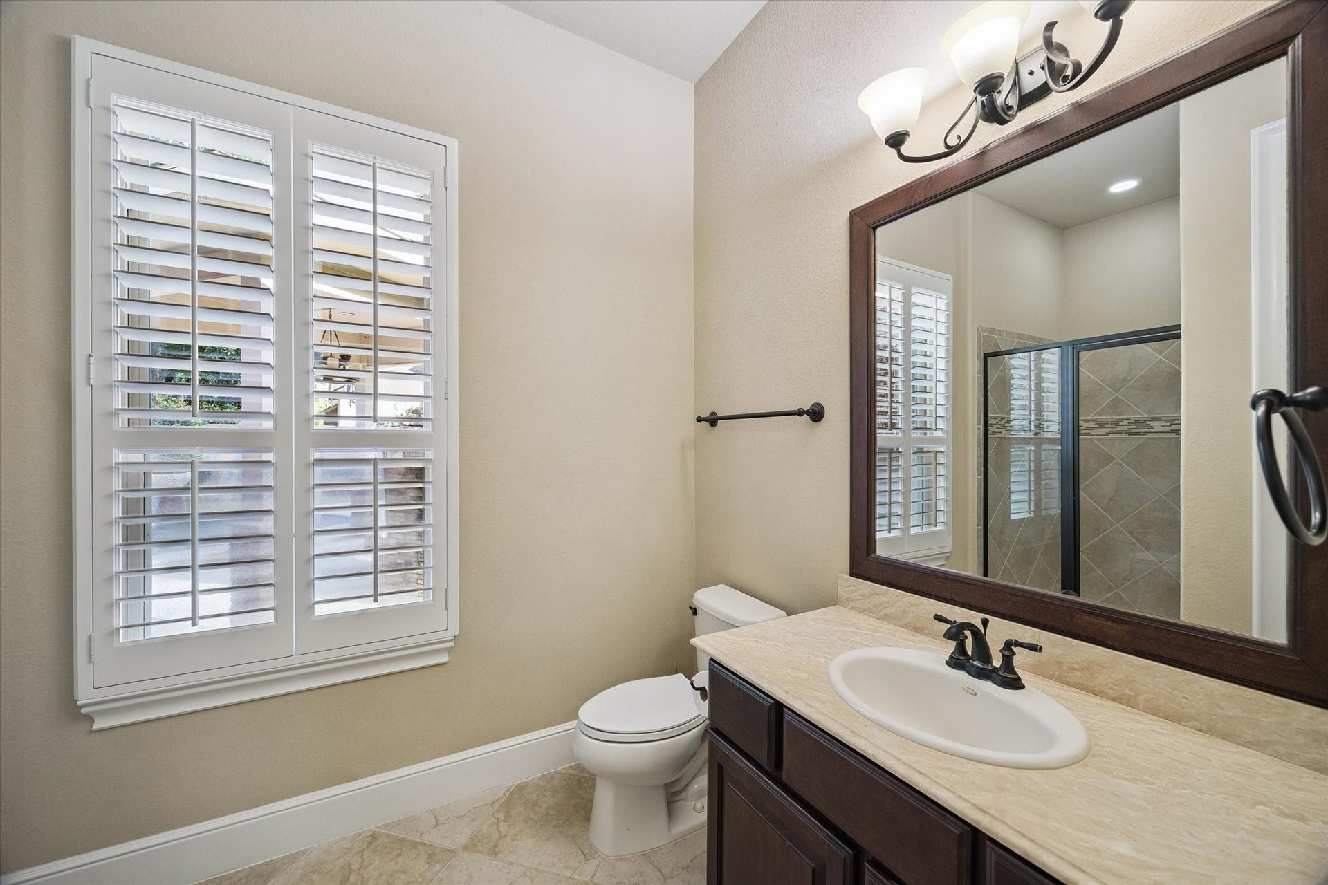 Designed with comfort in mind, the private en-suite bath complements the guest suite with quality finishes, generous counter space, and a welcoming atmosphere for family and visitors alike.