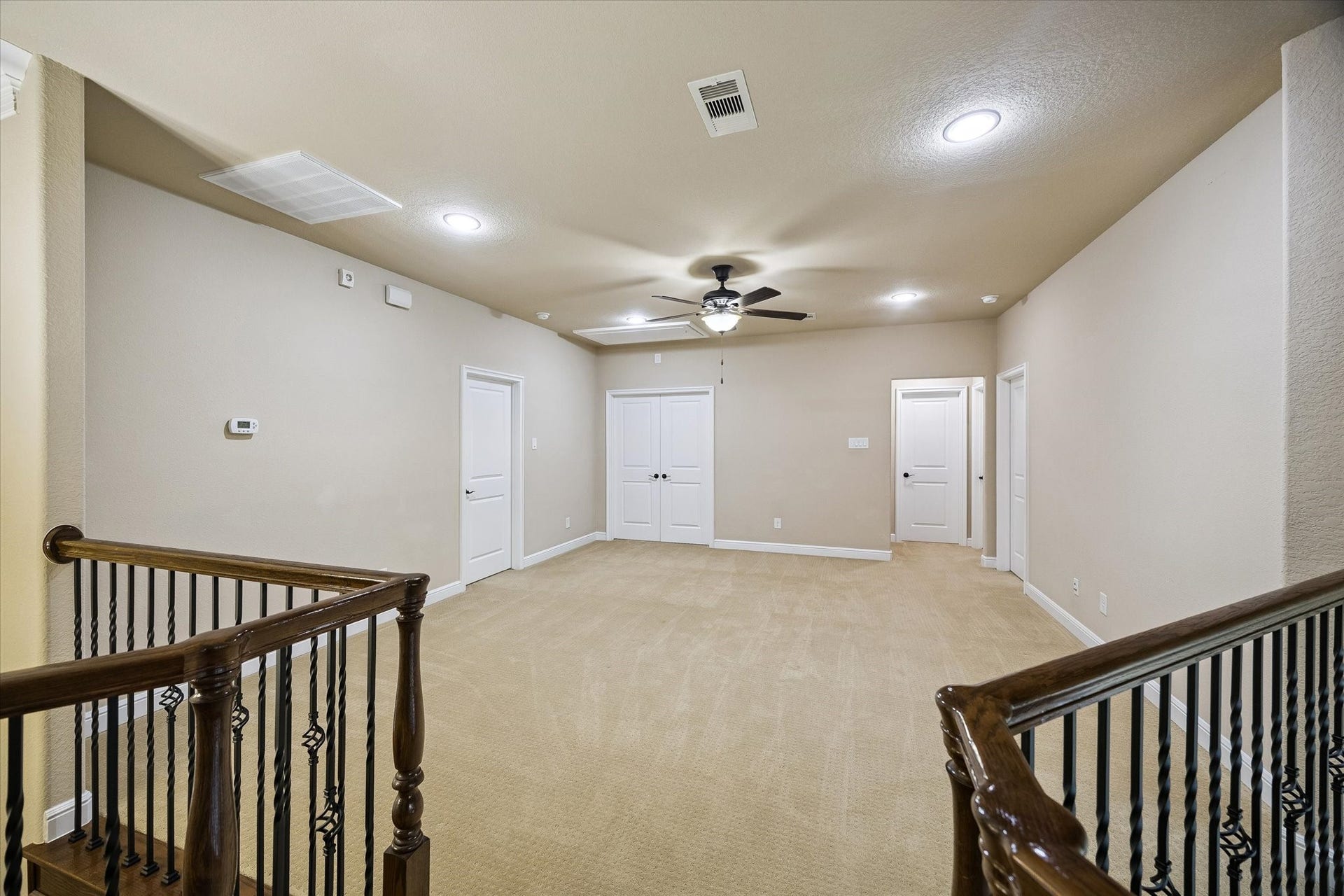 Anchoring the second floor, the expansive game room provides a versatile space for recreation, relaxation, or family gatherings. Conveniently situated between the secondary bedrooms and media room, it offers the perfect setting for game nights, watching television, or creating a customized entertainment space.