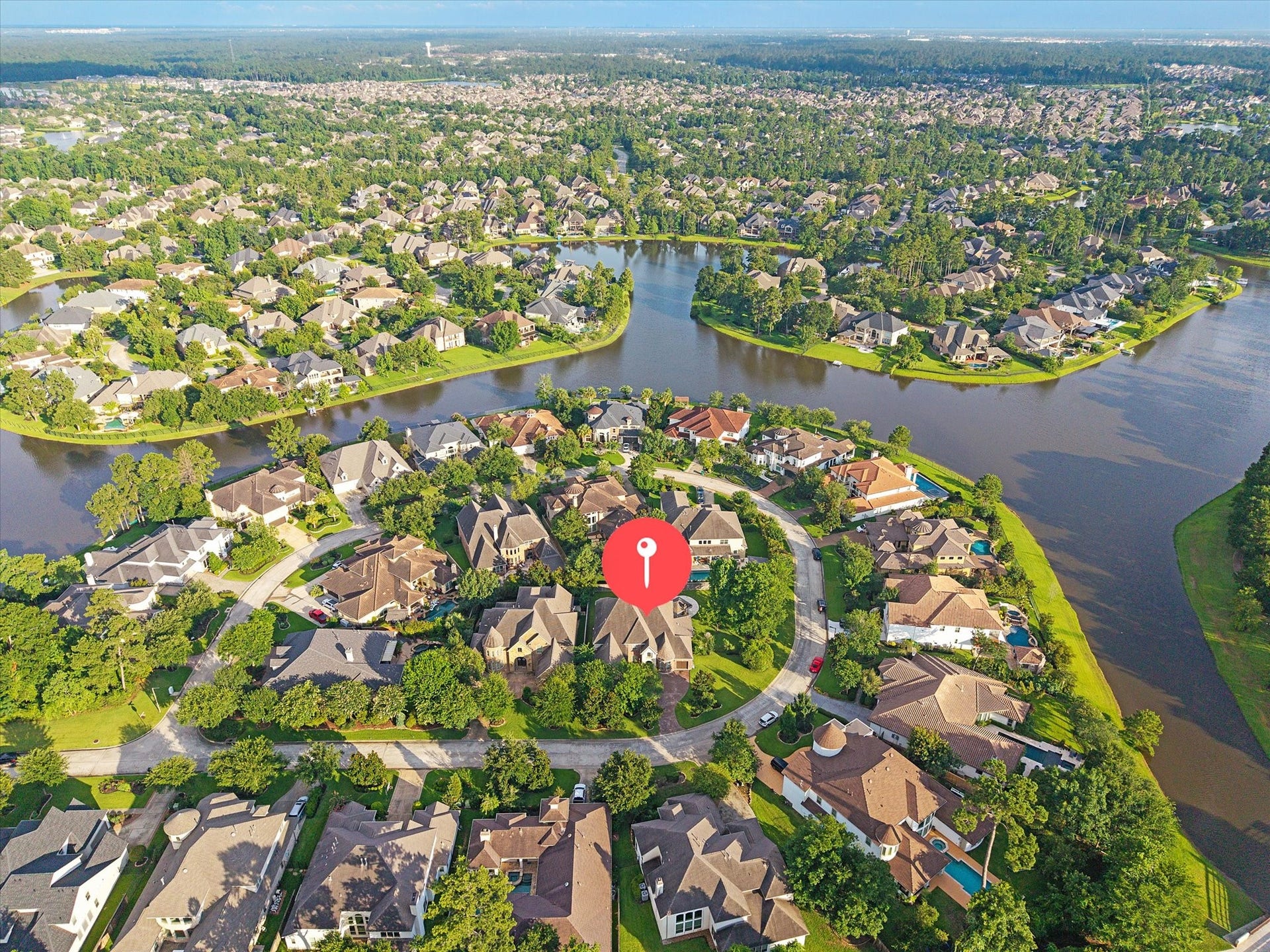 Ideally positioned on a corner lot, 35 N Fremont Ridge Loop enjoys a picturesque setting surrounded by scenic lakes, mature trees, and the natural beauty that defines the Creekside Park lifestyle.