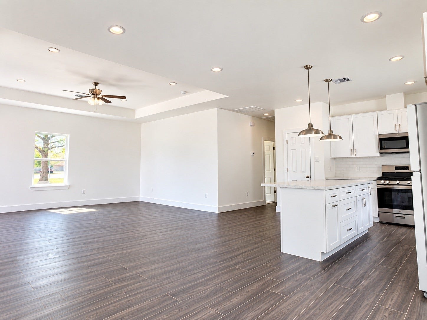 2505 11th Street, #LT6, Hempstead, TX 77445 Kitchen with living room view