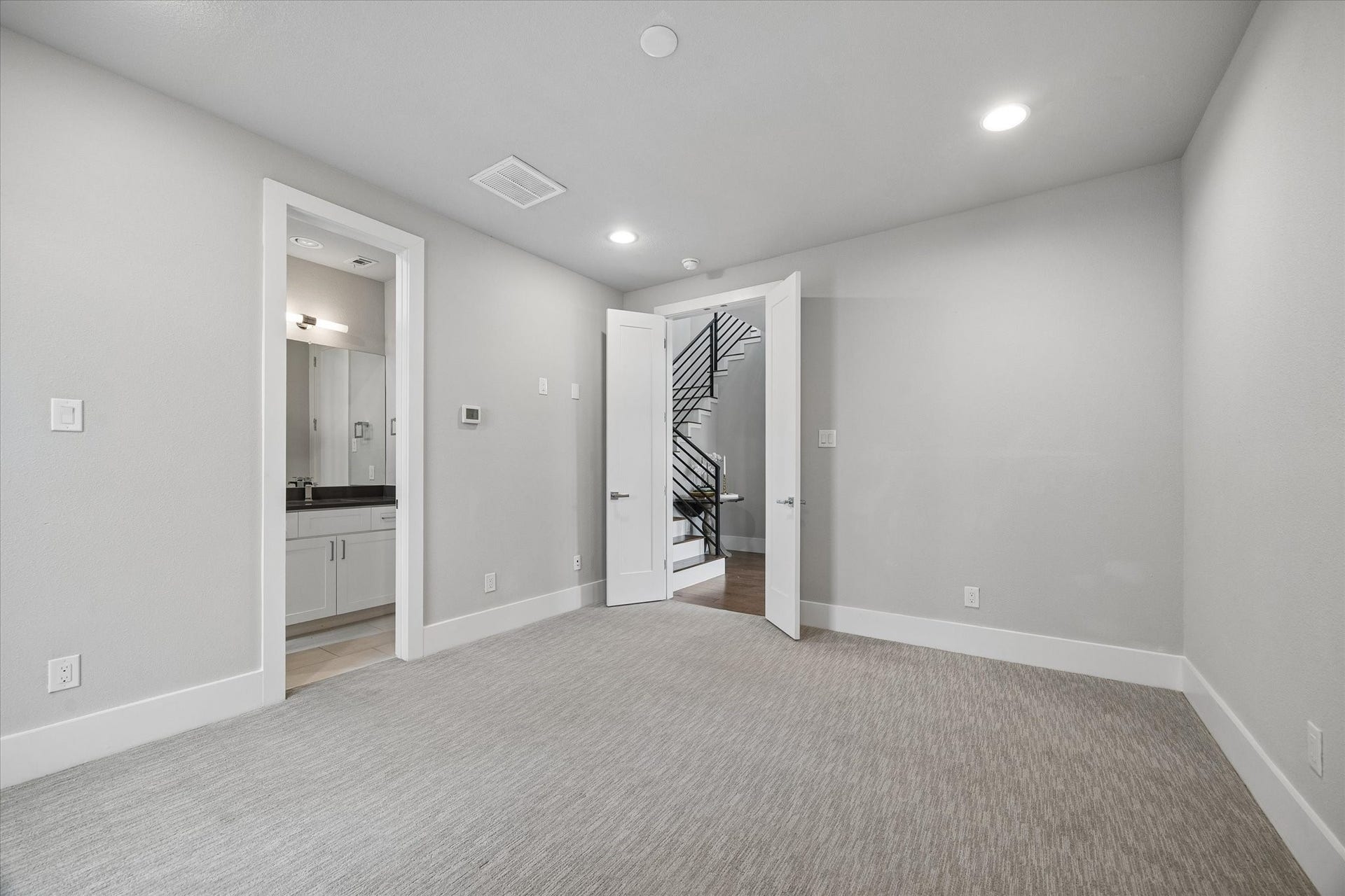 5707 Larkin Street, #B, Houston, TX 77007 First floor bedroom is spacious with lots of light and access to the grassed, fully fenced yard.