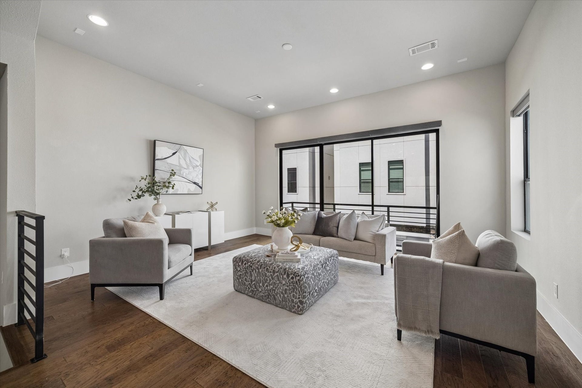 5707 Larkin Street, #B, Houston, TX 77007 We will start on the second floor - sleek lines, hardwood floors, and tons of natural light make this home easy to imagine as your own! Sliding glass doors open to the front of the home.