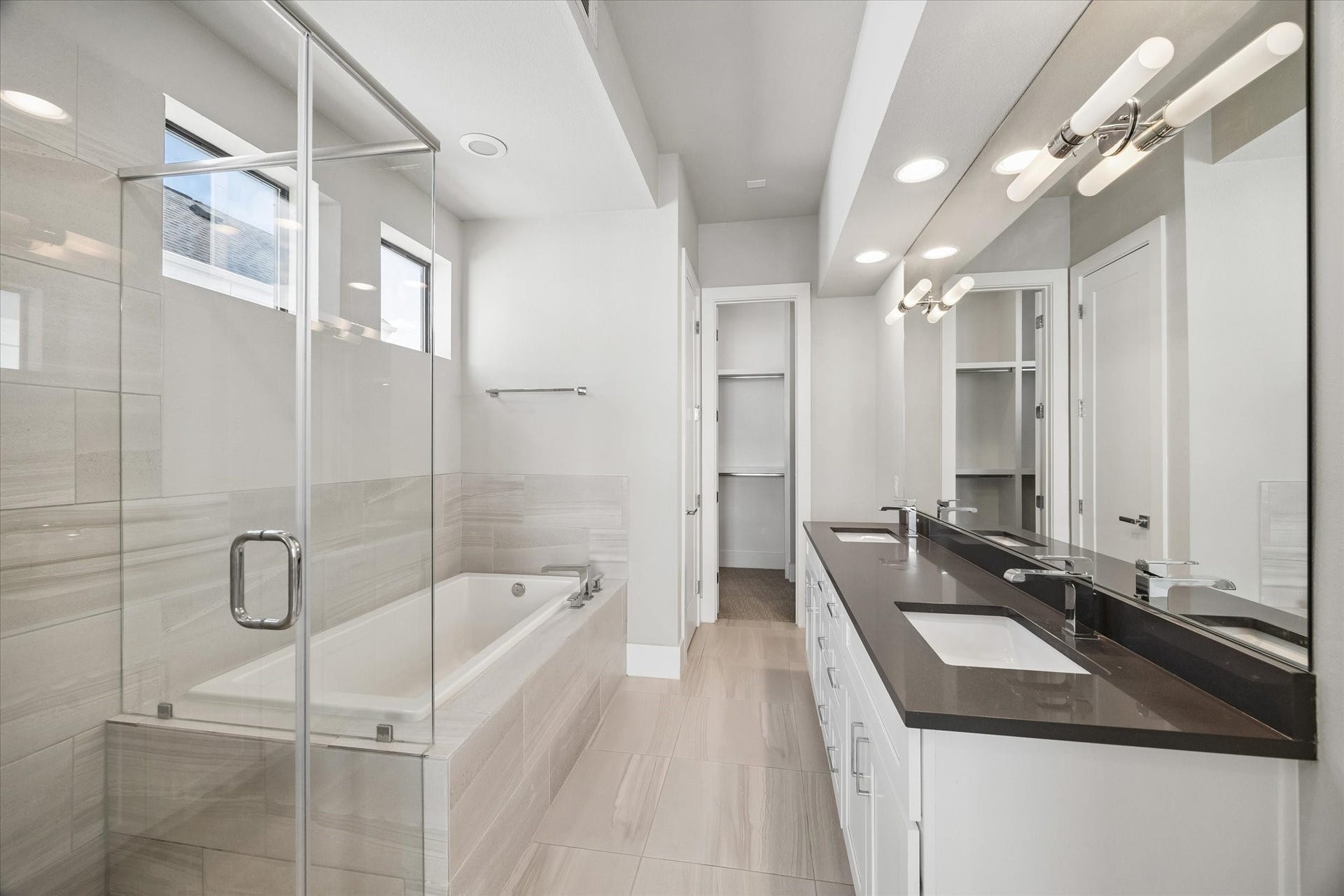 5707 Larkin Street, #B, Houston, TX 77007 This elegant primary bathroom has everything you need - grand soaking tub, standing shower, dual sinks, ample storage, natural light for getting ready, and a separate water closet for privacy!