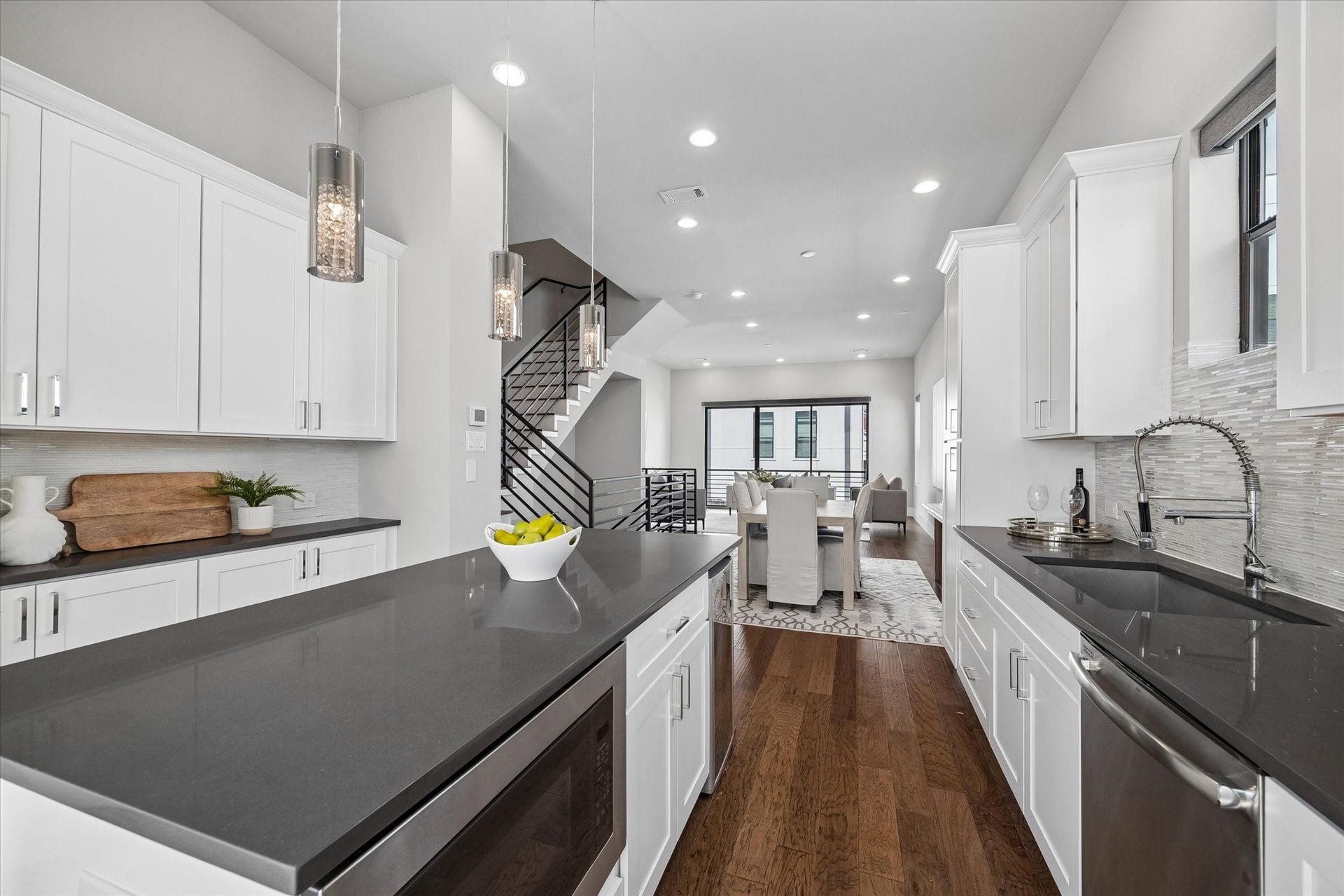 5707 Larkin Street, #B, Houston, TX 77007 Deep grey quartz countertops are both stylish and functional in this kitchen space. All appliances convey, including the full sized kitchen refridgerator and wine fridge.