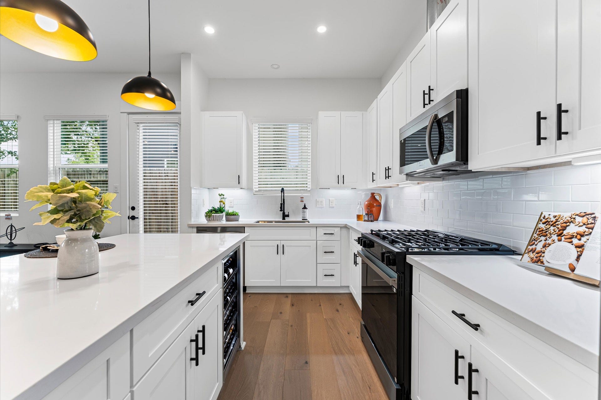 412 Neyland Street, #G, Houston, TX 77022 This stylish kitchen showcases plenty of sleek cabinetry, thoughtfully arranged to maximize storage and enhance the rooms modern aesthetic. Upper and lower cabinets feature clean lines and minimalist hardware, blending seamlessly with the spaces design. Integrated appliances and under-cabinet lighting add both function and flair, while the layout easy access and efficient organization. Ideal for culinary enthusiasts and entertainers alike, this kitchen combines smart storage with sophisticated style.