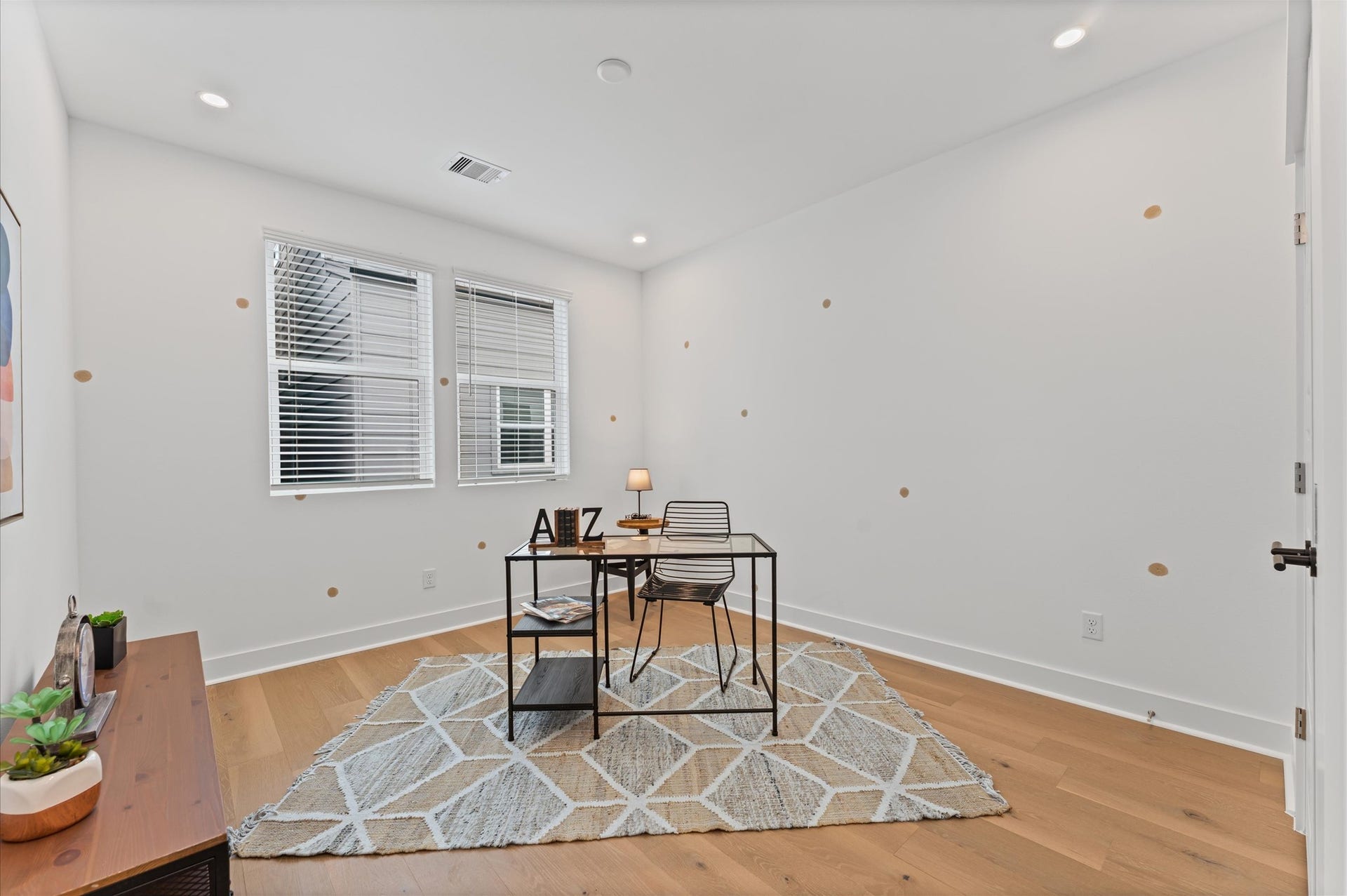 412 Neyland Street, #G, Houston, TX 77022 This versatile secondary bedroom on the second floor is currently staged as a stylish home office, featuring a sleek desk setup, ample natural light, and minimalist dcor that enhances focus and creativity. Its neutral palette and uncluttered layout make it easy to reimagine, whether as a cozy guest room, a serene yoga space, or a vibrant playroom. The rooms flexible design invites endless possibilities, adapting effortlessly to suit changing needs and lifestyles.