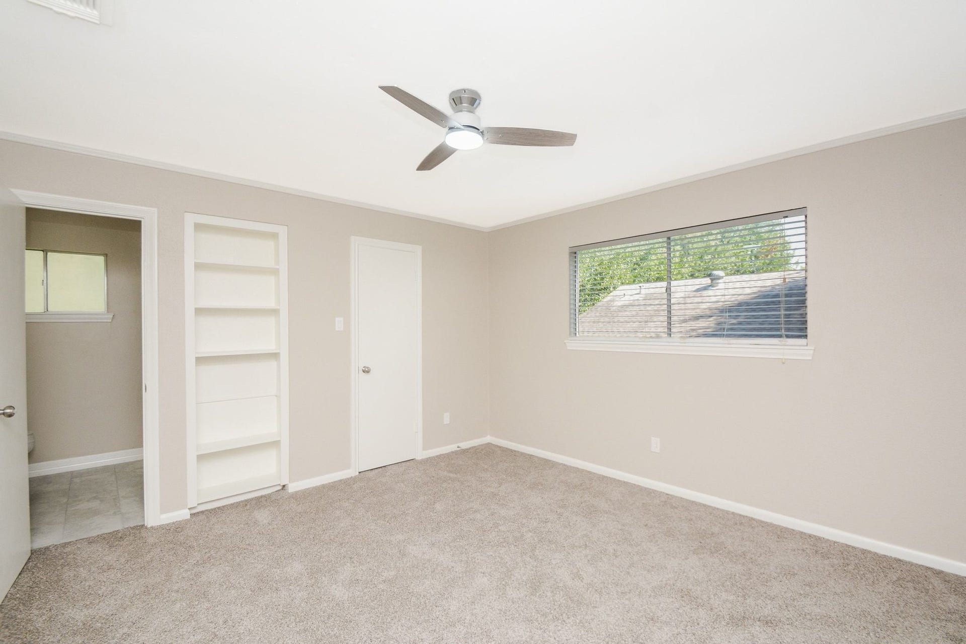 3018 Apple Valley Lane, Missouri City, TX 77459 Lush carpeting, built in storage and high double windows (more space below!) brighten this bedroom.