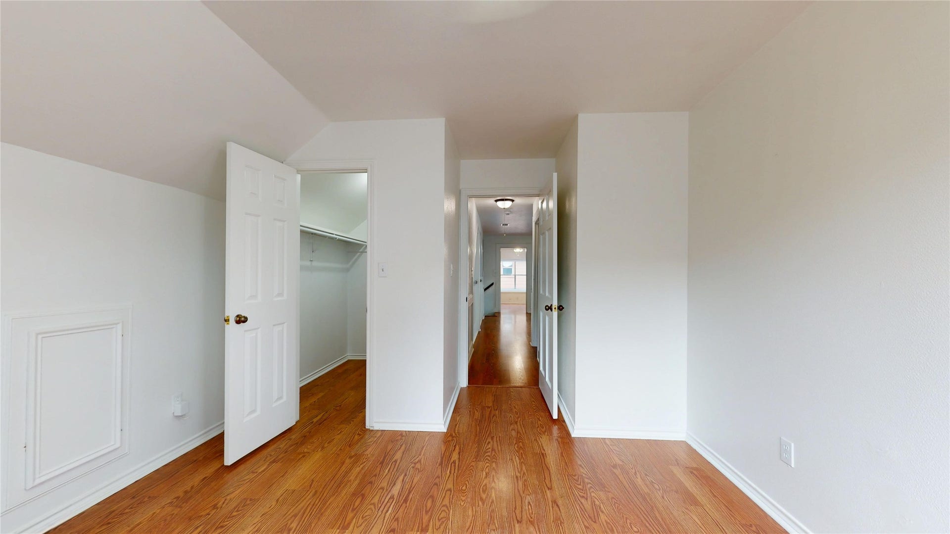 1407 Sherfield Ridge Drive, Katy, TX 77450 1407 Sherfield Ridge Dr, Bedroom #4 on the 2nd floor and at the end of the halway. Laminate wooden flooring and walk-in closet.