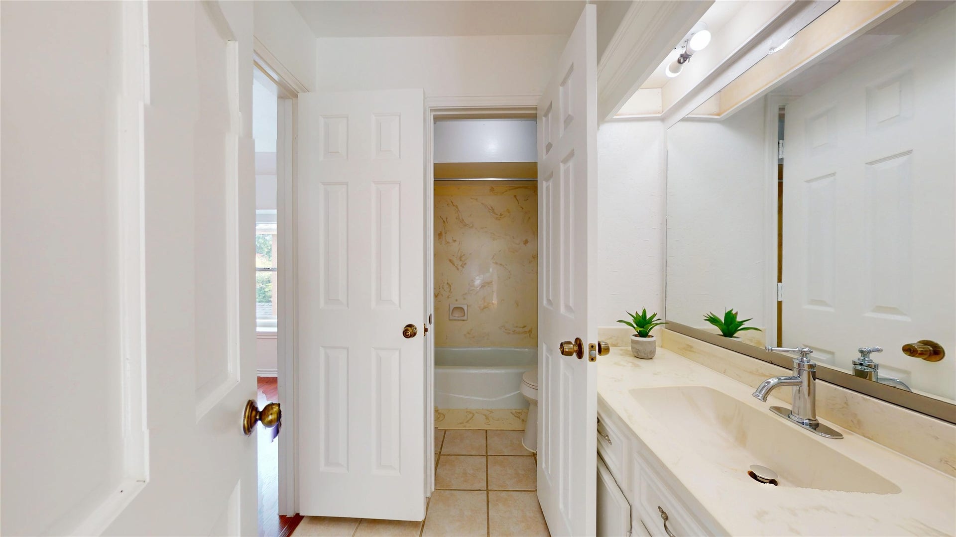 1407 Sherfield Ridge Drive, Katy, TX 77450 1407 Sherfield Ridge Dr, 2nd upstairs bathroom, with shower tub seperated from white single vanity.