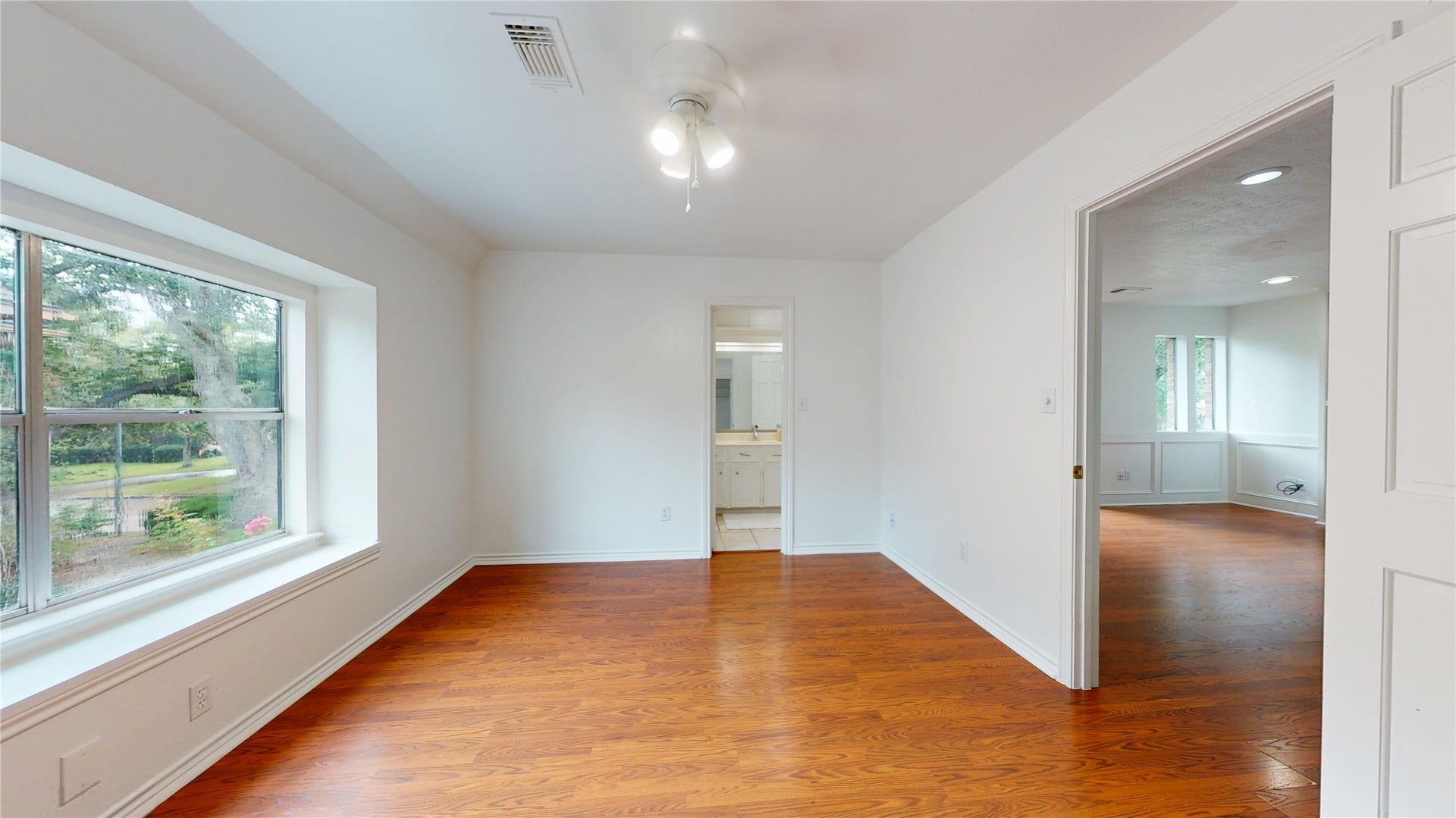 1407 Sherfield Ridge Drive, Katy, TX 77450 1407 Sherfield Ridge Dr, Bedroom #2 located on 2nd floor with double door closet and bay large window for natural lighting. Warm wooden flooring throughout the 2nd floor.