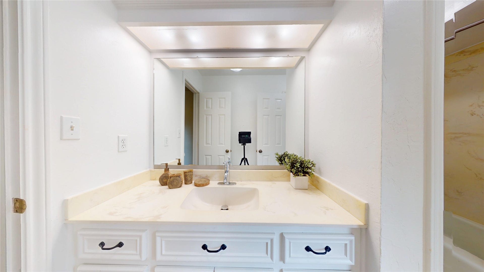 1407 Sherfield Ridge Drive, Katy, TX 77450 1407 Sherfield Ridge Dr, Jack and jill 3rd bathroom, vanity area with white cabinetry and single sink.