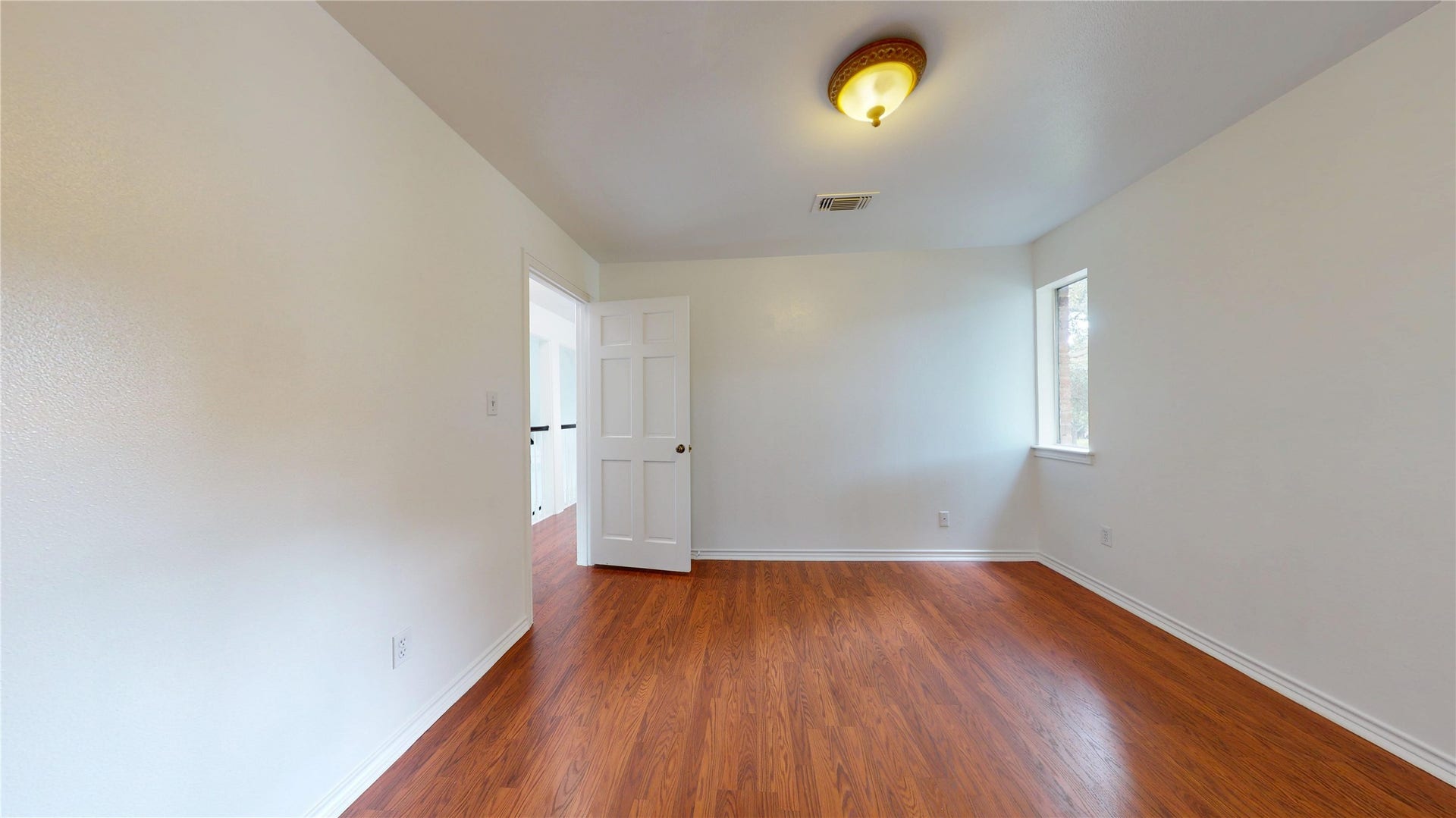 1407 Sherfield Ridge Drive, Katy, TX 77450 1407 Sherfield Ridge Dr, Bedroom #3 on the 2nd floor with wooden laminate flooring, walk-in closet and entry to jack-and-jill bathroom.