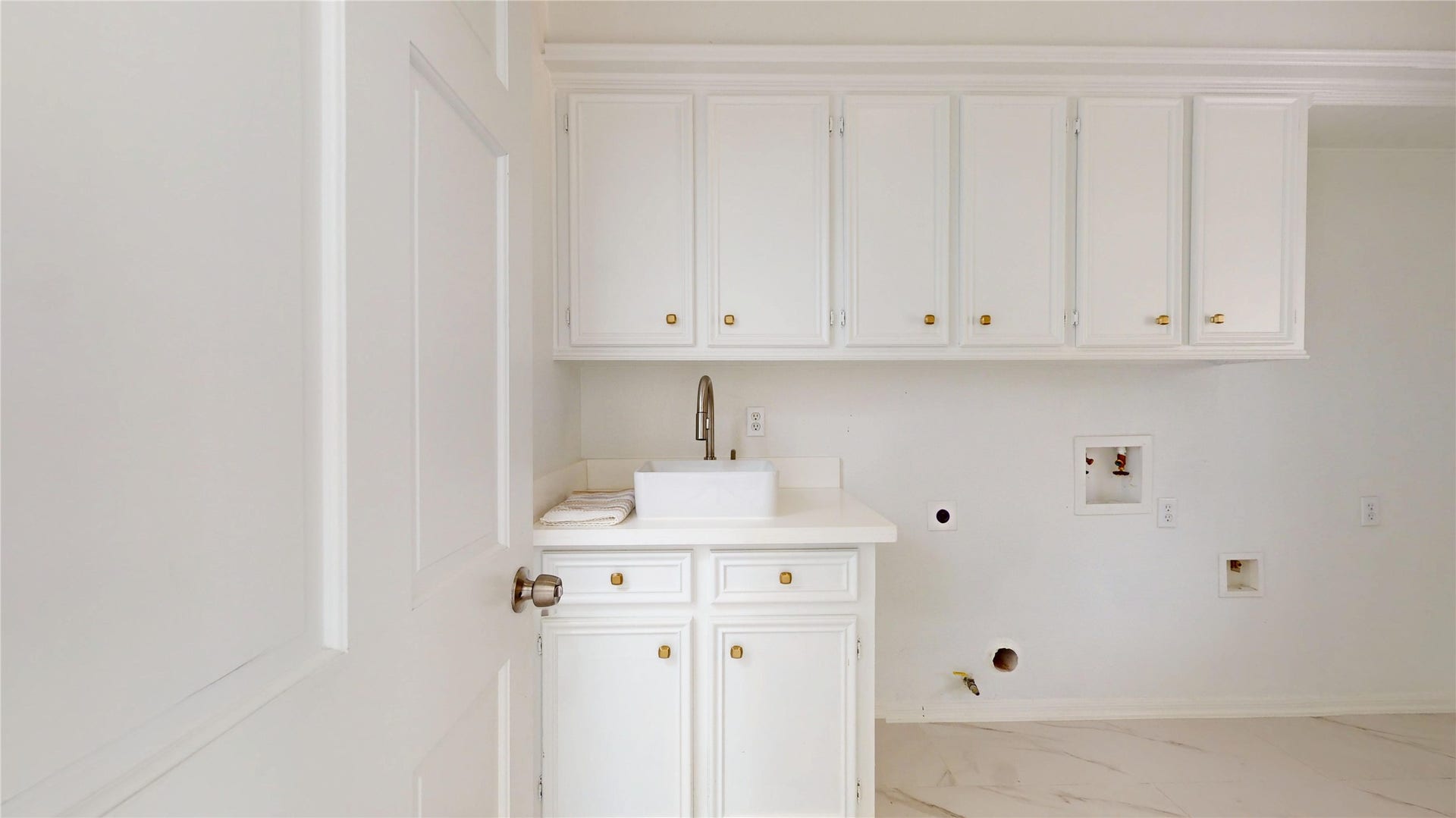 1407 Sherfield Ridge Drive, Katy, TX 77450 1407 Sherfield Ridge Dr, Laundry room with white cabinetry, great for storage, with a sink and washer & dryer connections.