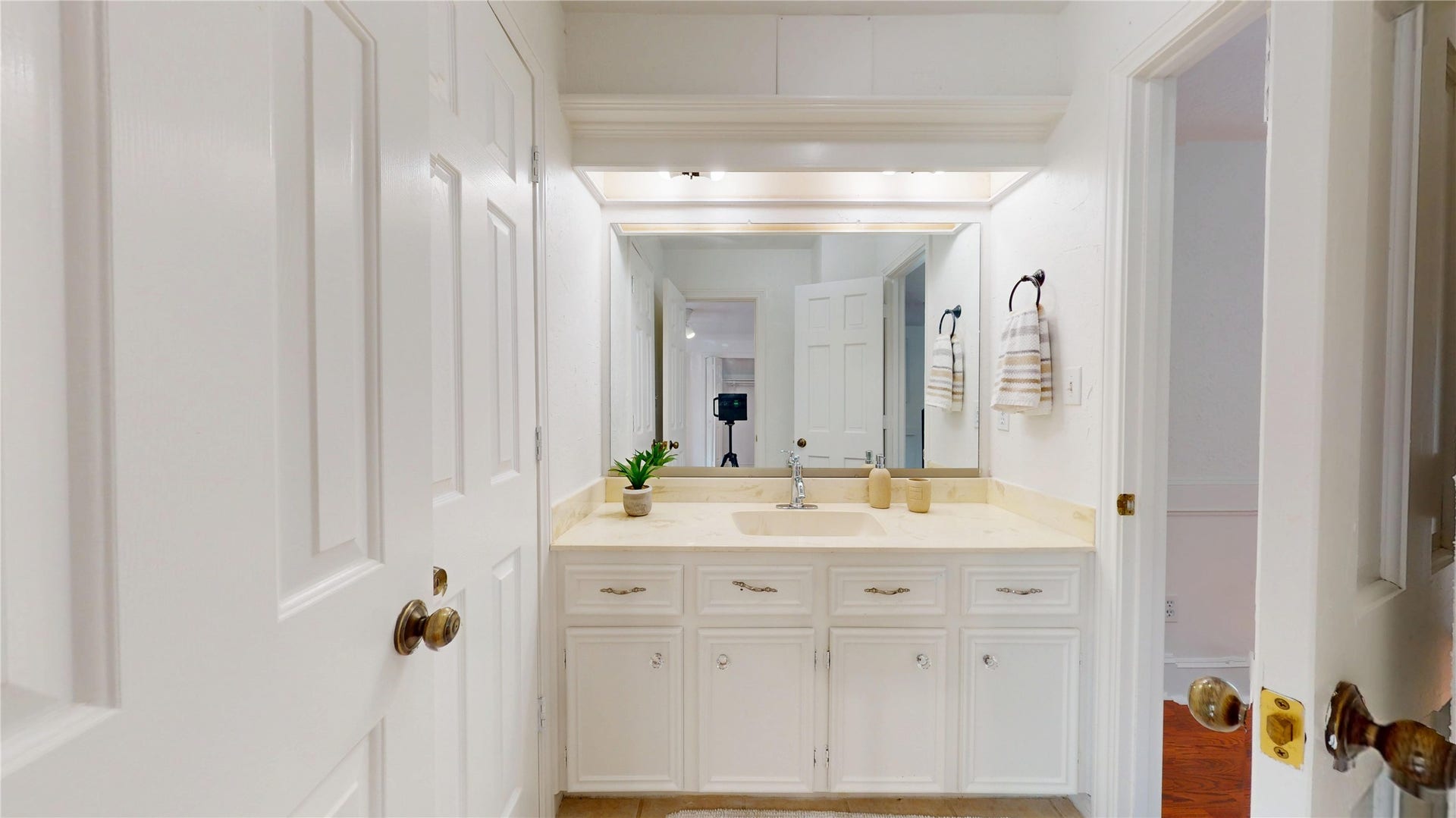 1407 Sherfield Ridge Drive, Katy, TX 77450 1407 Sherfield Ridge Dr, 2nd upstairs bathroom, white single vanity and entrance to bedroom.