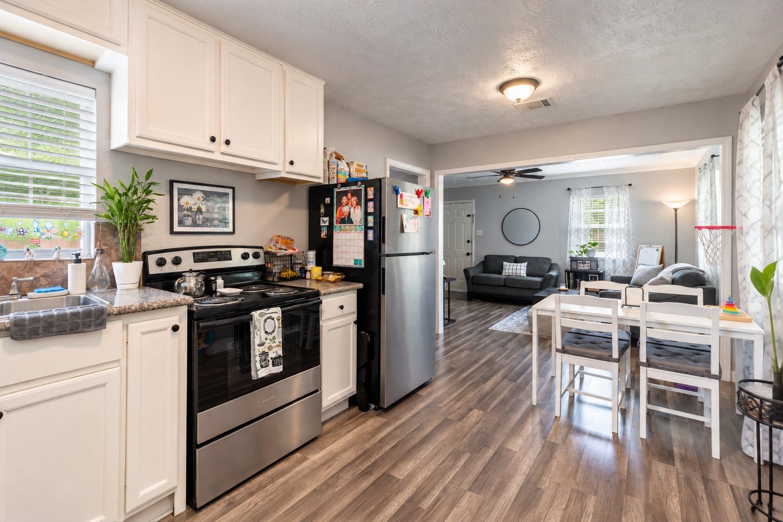 903 Willow Street, Pasadena, TX 77506 Open-concept kitchen and dining area offering a fantastic flow into the spacious living room, with durable flooring and plenty of room for everyday living and entertaining.