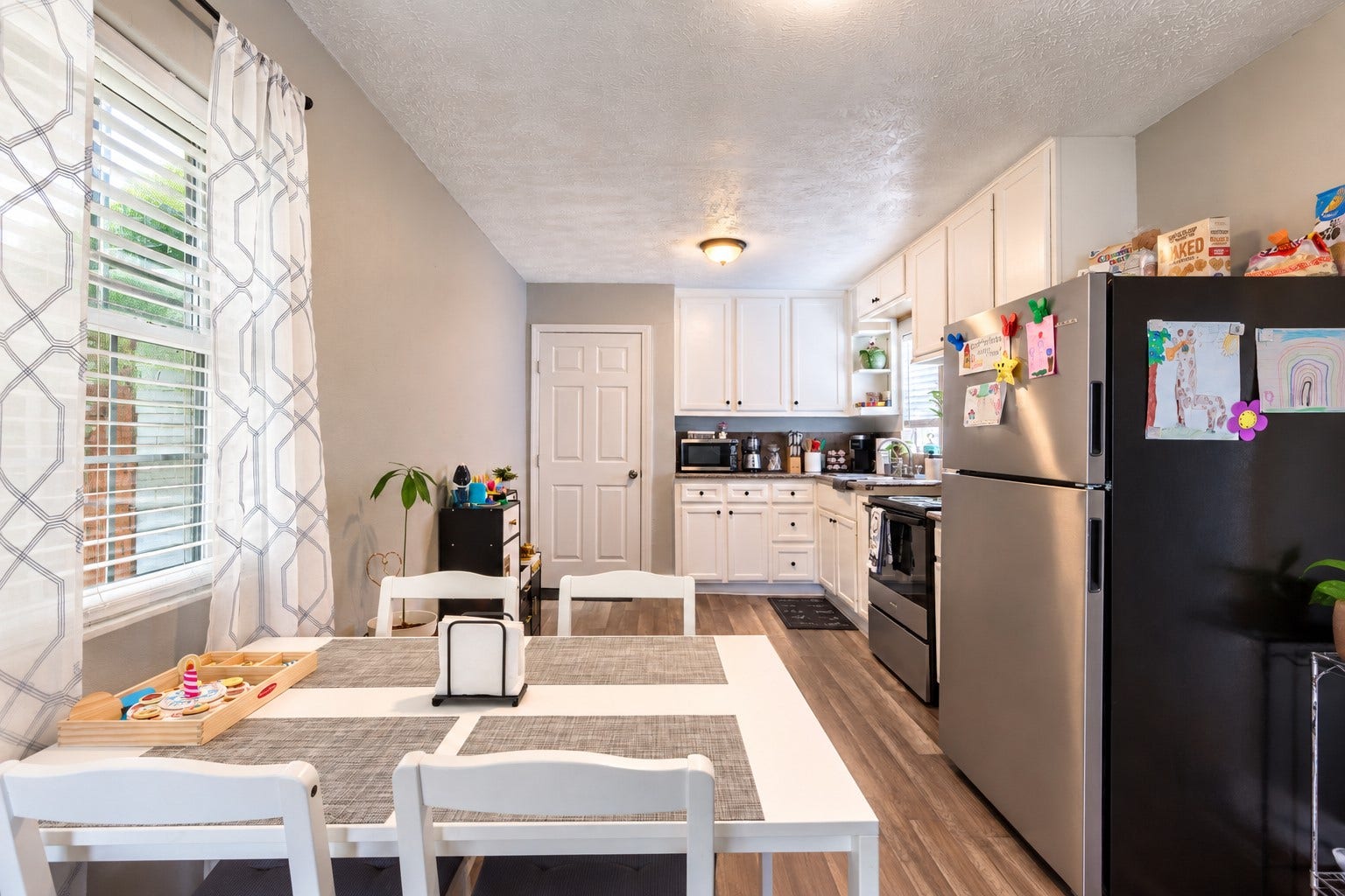 903 Willow Street, Pasadena, TX 77506 Kitchen features white cabinetry, granite countertops, & stainless steel appliances that are staying with the home!