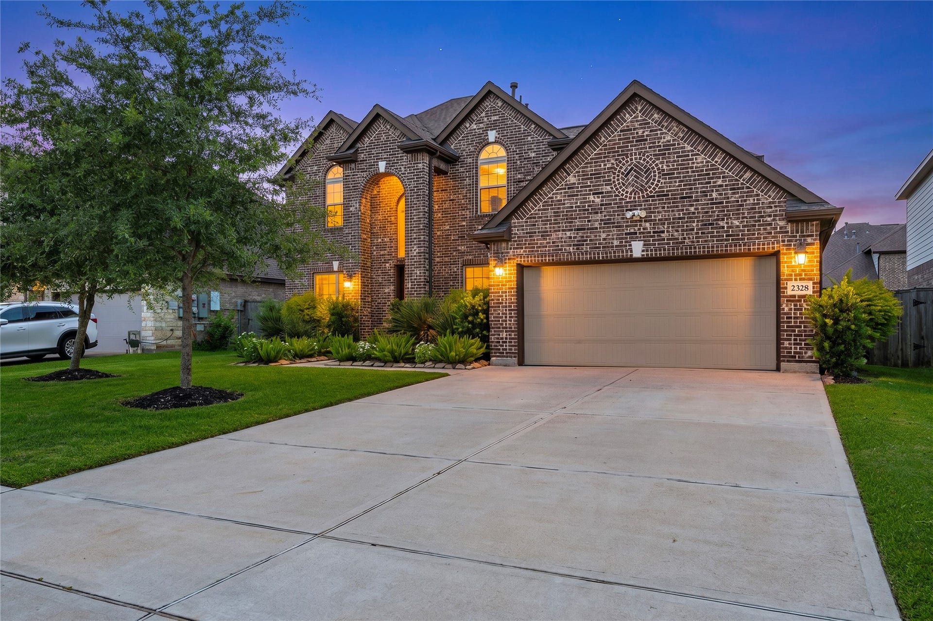 2328 Majestic Fairway Lane, League City, TX 77573 Twilight view of the home in the evening hours.