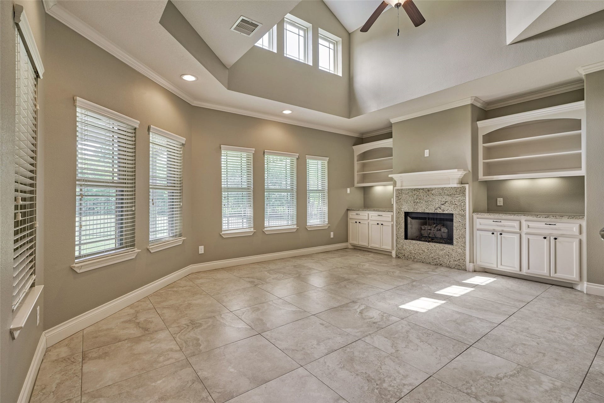 119 Bessie Price Owens Drive, Montgomery, TX 77356 Nice architectural features in this townhome! A wall of windows, toasty fireplace and custom built-in cabinetry.