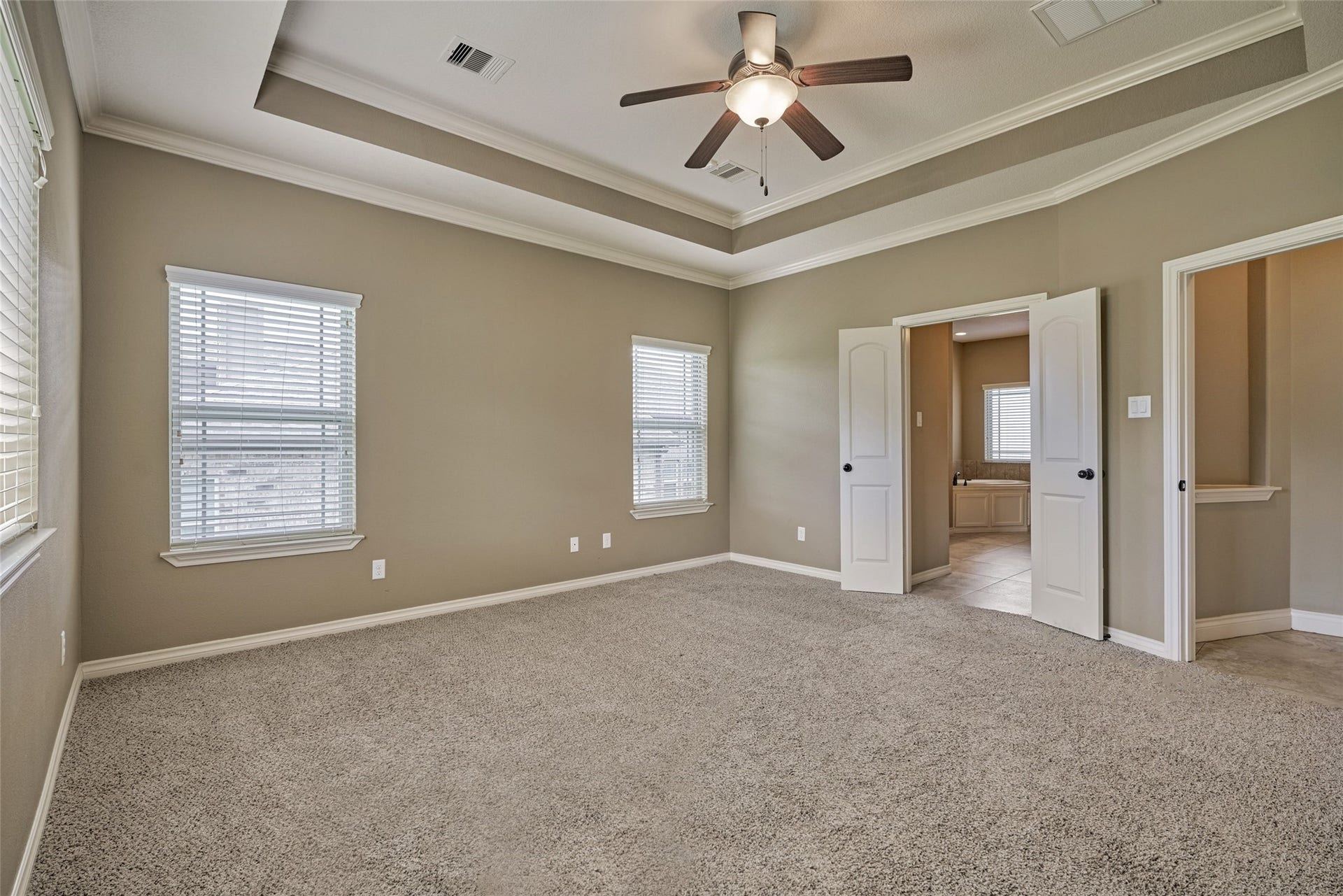 119 Bessie Price Owens Drive, Montgomery, TX 77356 French doors lead to the primary ensuite.