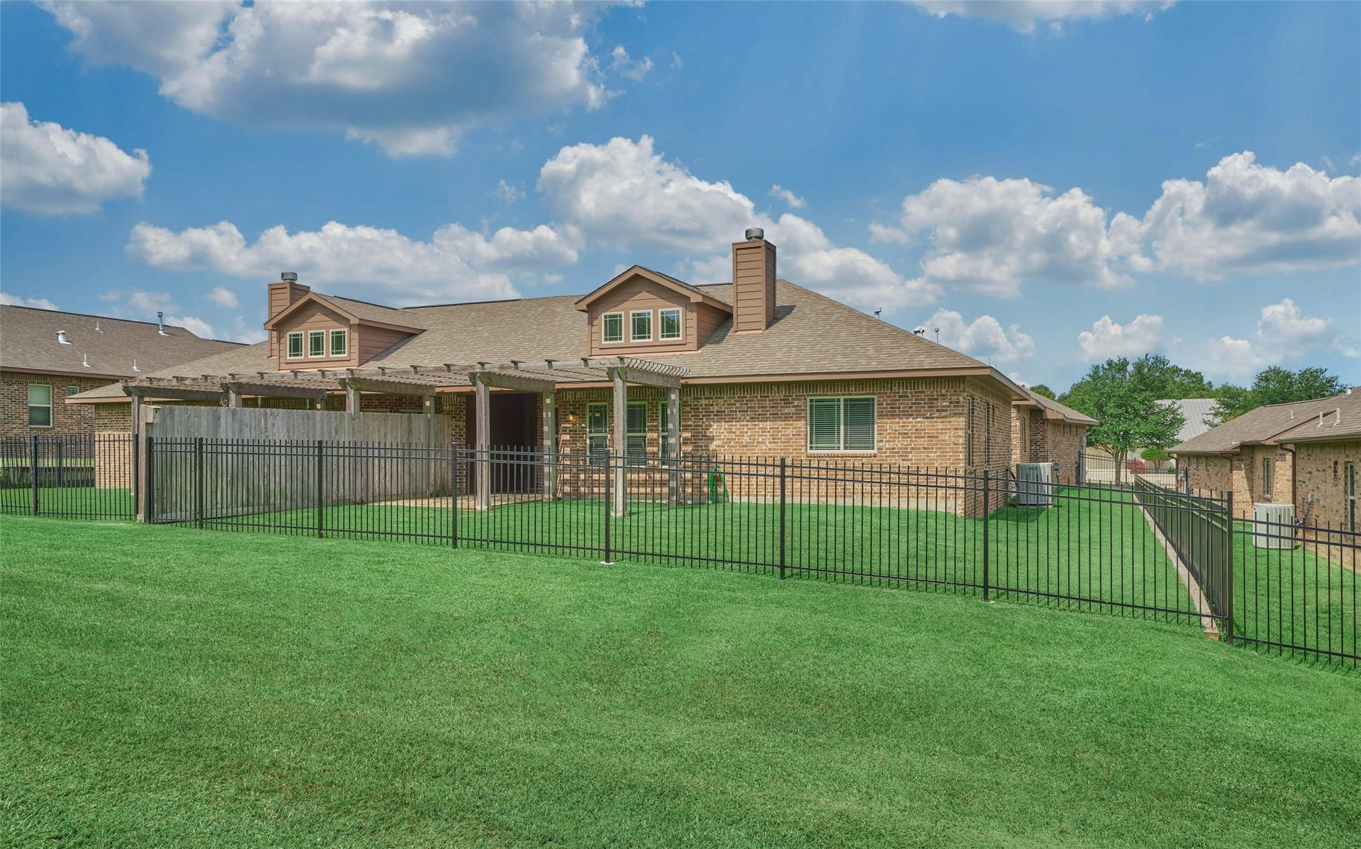 119 Bessie Price Owens Drive, Montgomery, TX 77356 A view of the back elevation.