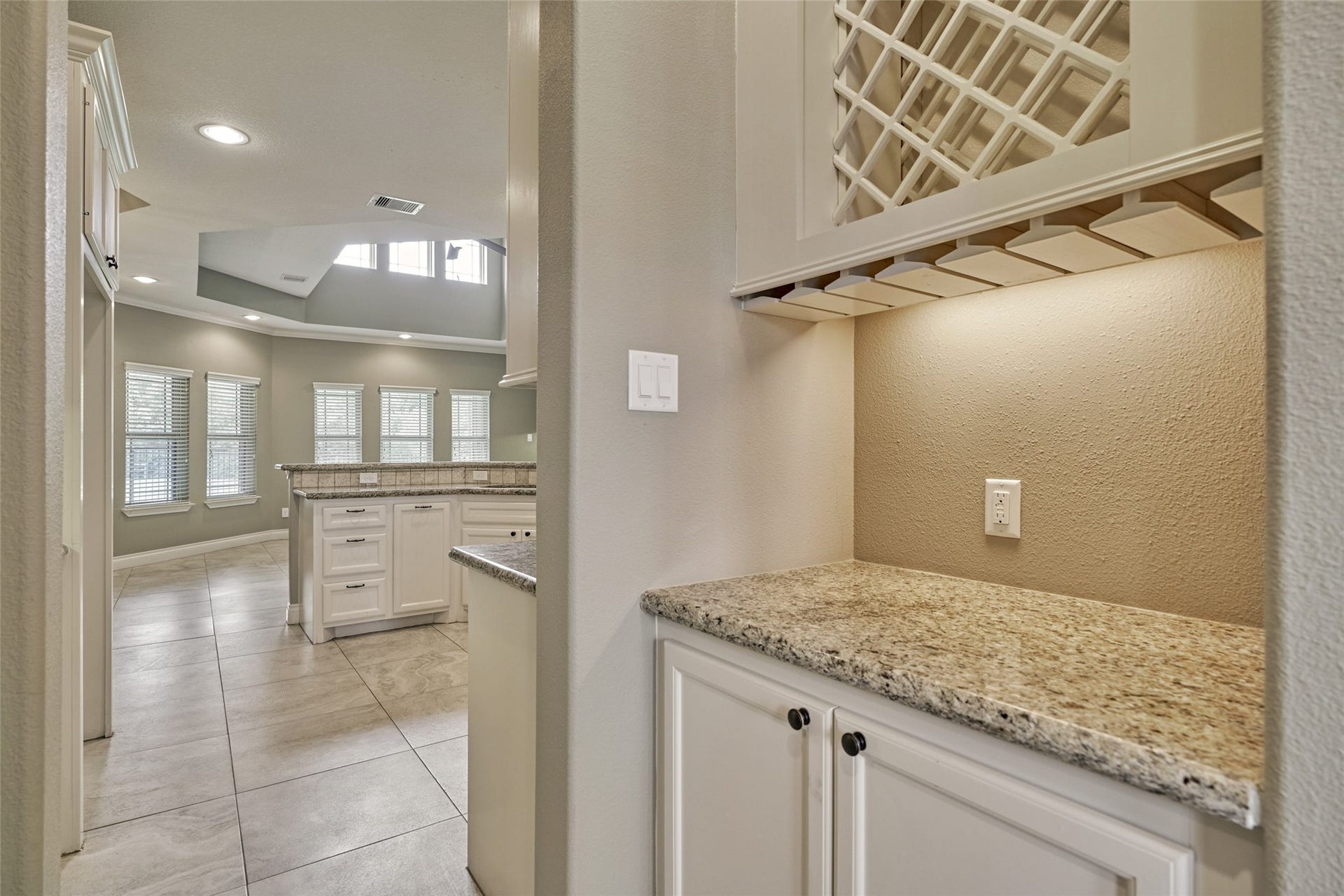 119 Bessie Price Owens Drive, Montgomery, TX 77356 Passing from the dining room to the kitchen is a butler's pantry complete with wine rack.
