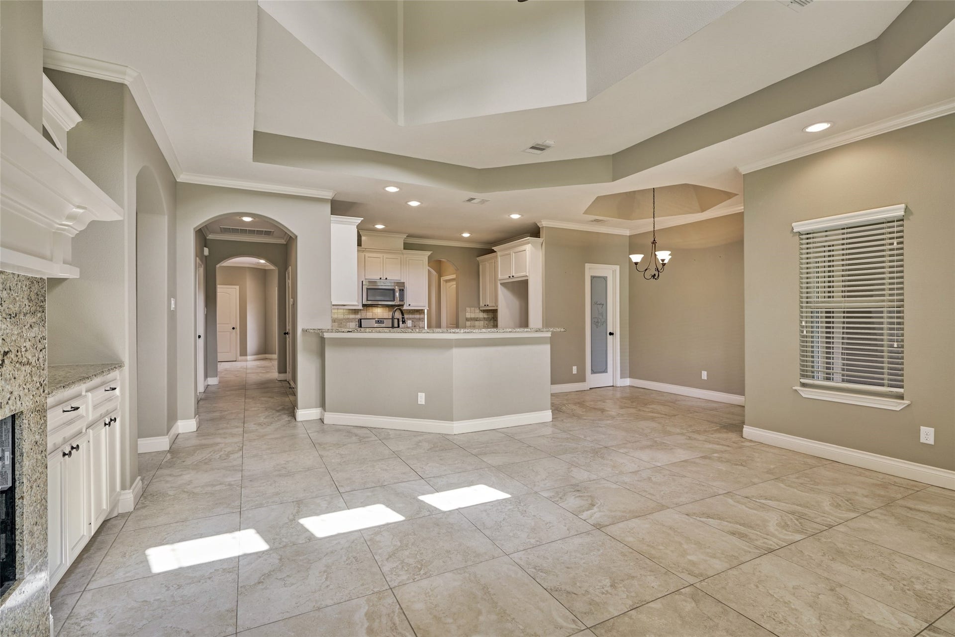 119 Bessie Price Owens Drive, Montgomery, TX 77356 A view of the kitchen and breakfast area from the living room. The kitchen is centrally located allowing a nice flow.