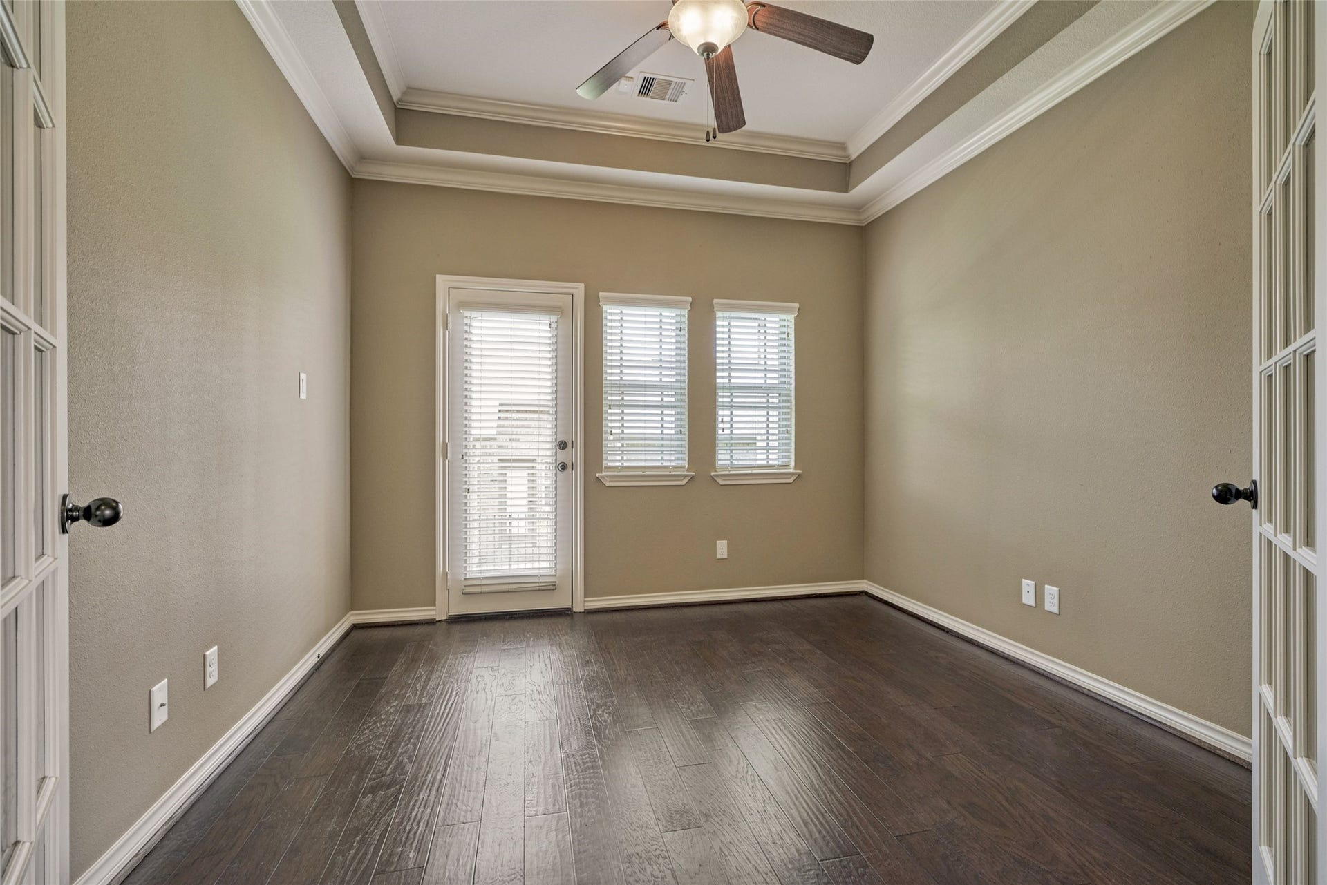 119 Bessie Price Owens Drive, Montgomery, TX 77356 Another view of the study with trey ceiling and rich wood flooring. The exterior door gives access to the side yard.