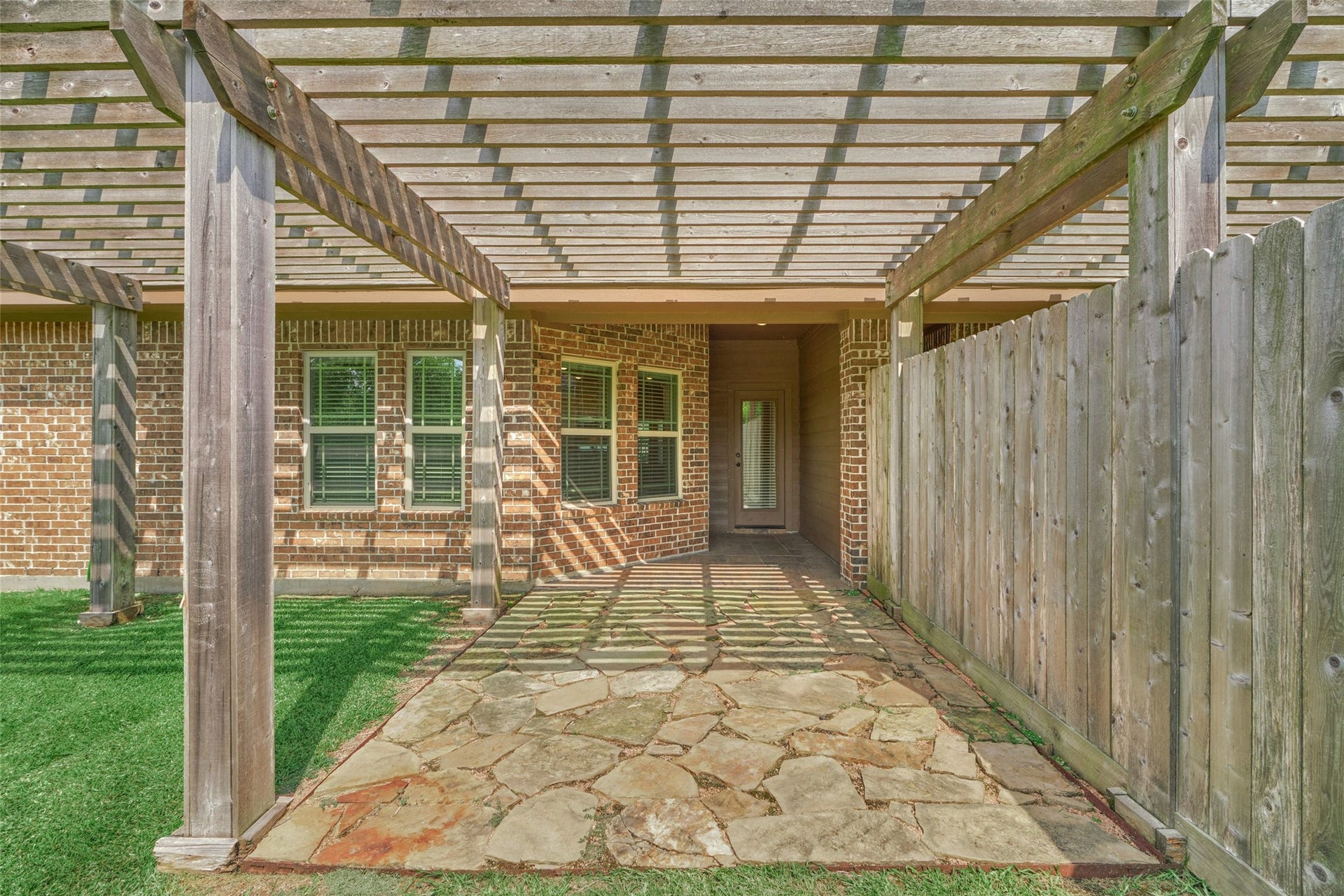 119 Bessie Price Owens Drive, Montgomery, TX 77356 Back patio with pergola to enjoy your morning coffee or afternoon cocktail.