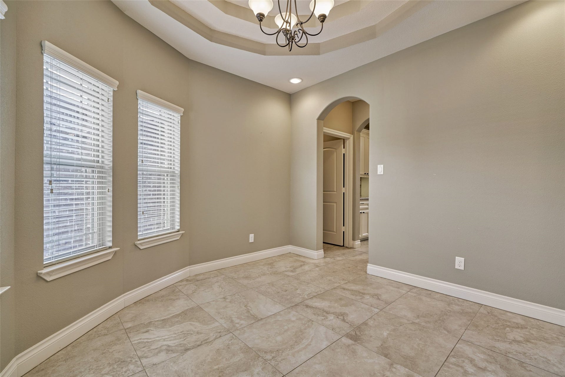 119 Bessie Price Owens Drive, Montgomery, TX 77356 Dining room with trey ceiling has a wall full of windows for lots of natural light.