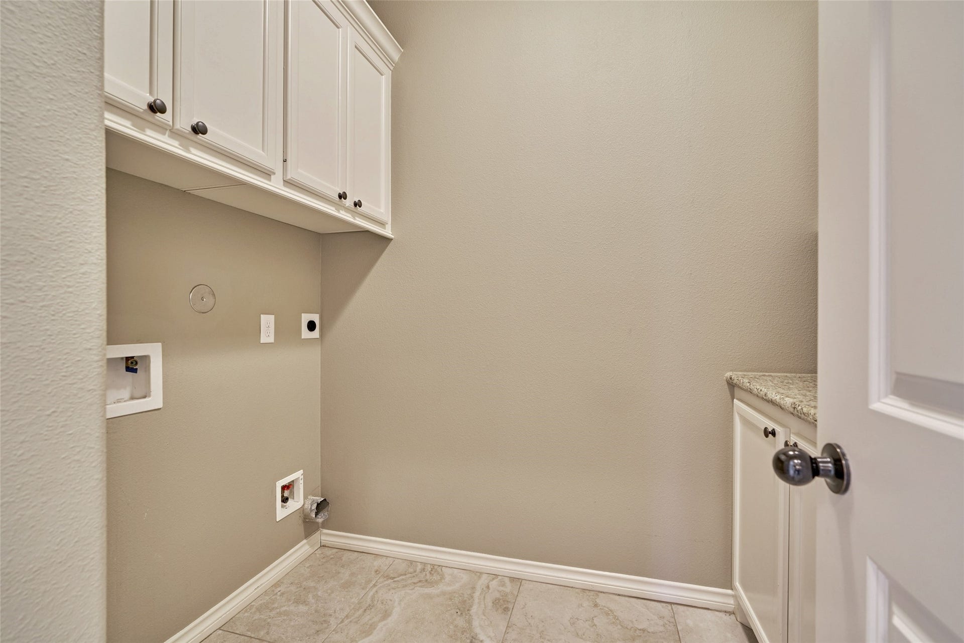 119 Bessie Price Owens Drive, Montgomery, TX 77356 Laundry room with ample storage.