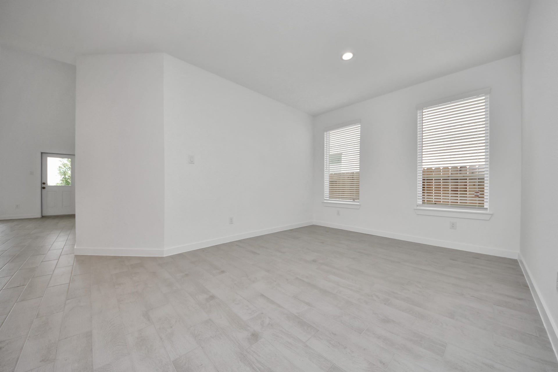 Make memories gathered around the table with your family and friends! This spacious dining room features elegant flooring, custom paint, and adjacent to family room and kitchen for open concept feel. Sample photo of completed home with similar floor plan. Actual colors and selections may vary.