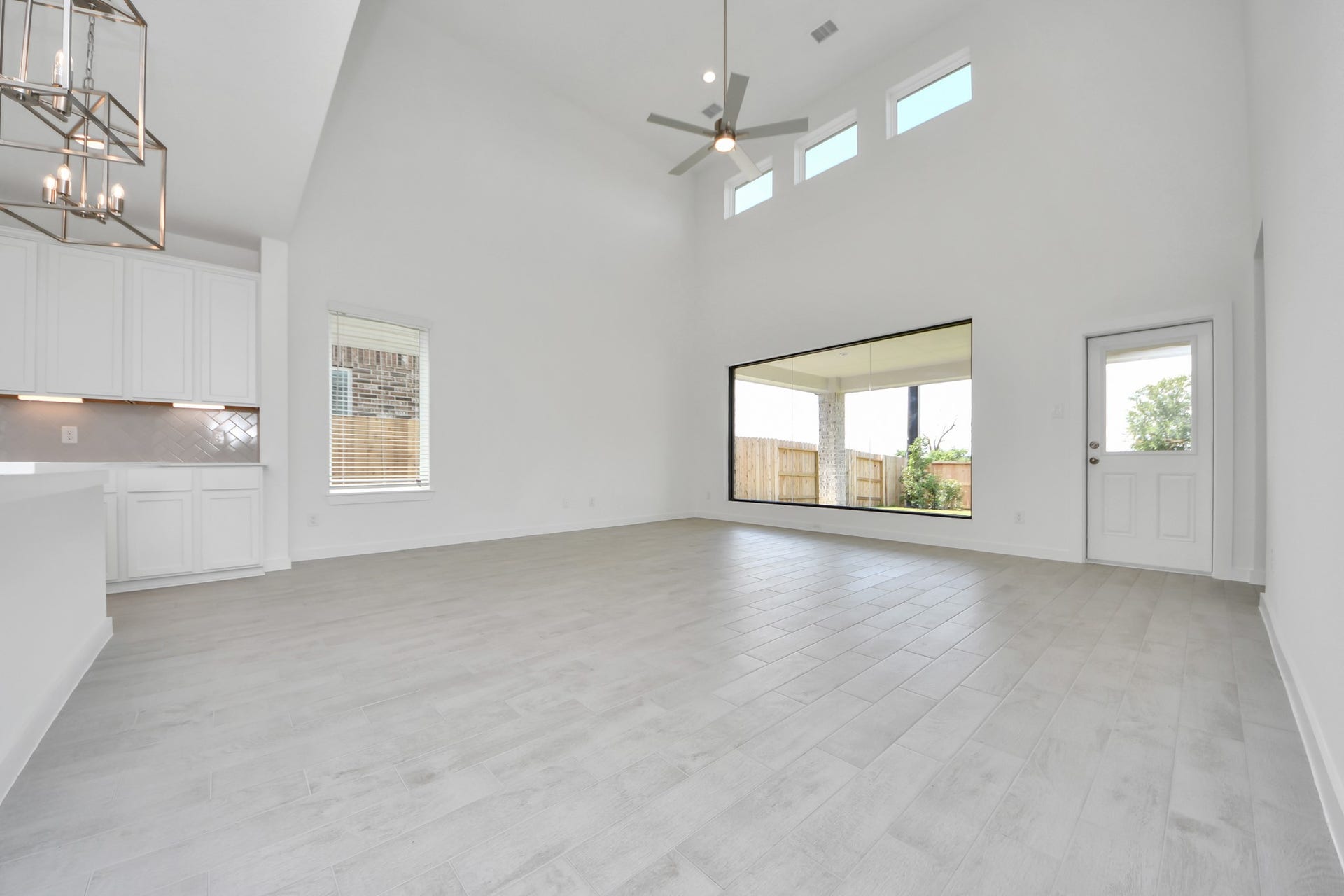Take another glimpse into the heart of the home with this additional view of the family rooma sprawling space ready to accommodate all your gatherings. Sample photo of completed home with similar floor plan. Actual colors and selections may vary.