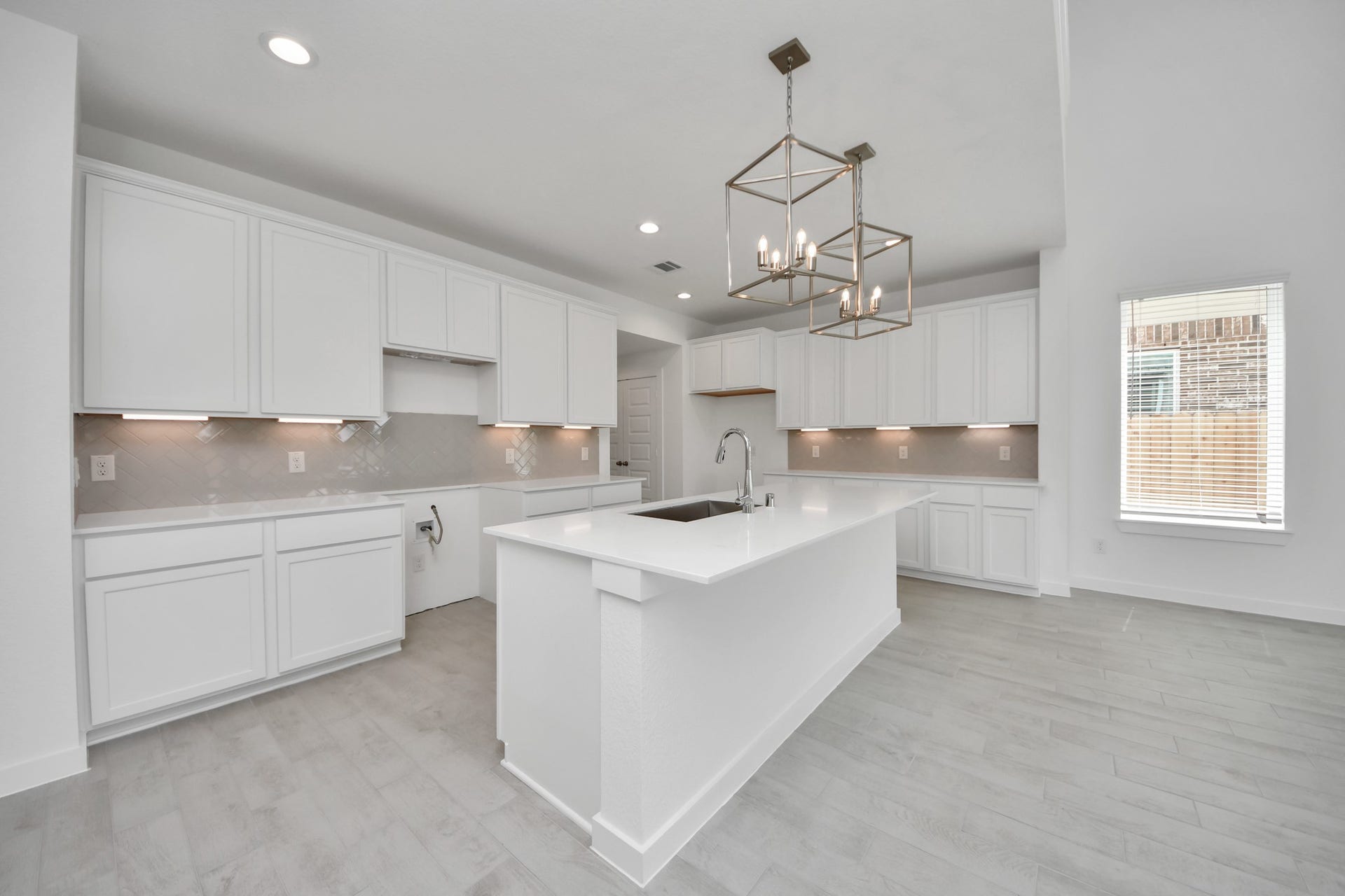 The extended counter area adds both practicality and style, making meal preparation a breeze. Every detail is thoughtfully designed to enhance the kitchen's functionality and aesthetic appeal. Sample photo of completed home with similar floor plan. Actual colors and selections may vary.