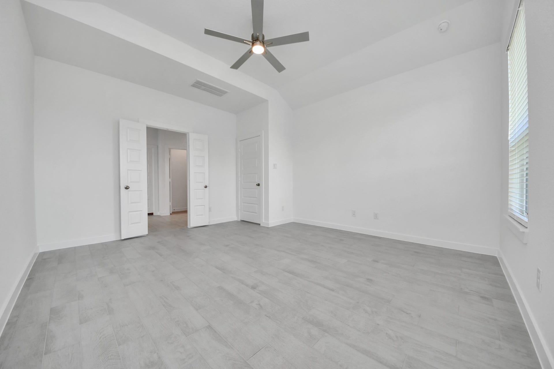Another perspective unveils a comprehensive view of the serenity and comfort this primary suite offers. Sample photo of completed home with similar floor plan. Actual colors and selections may vary.