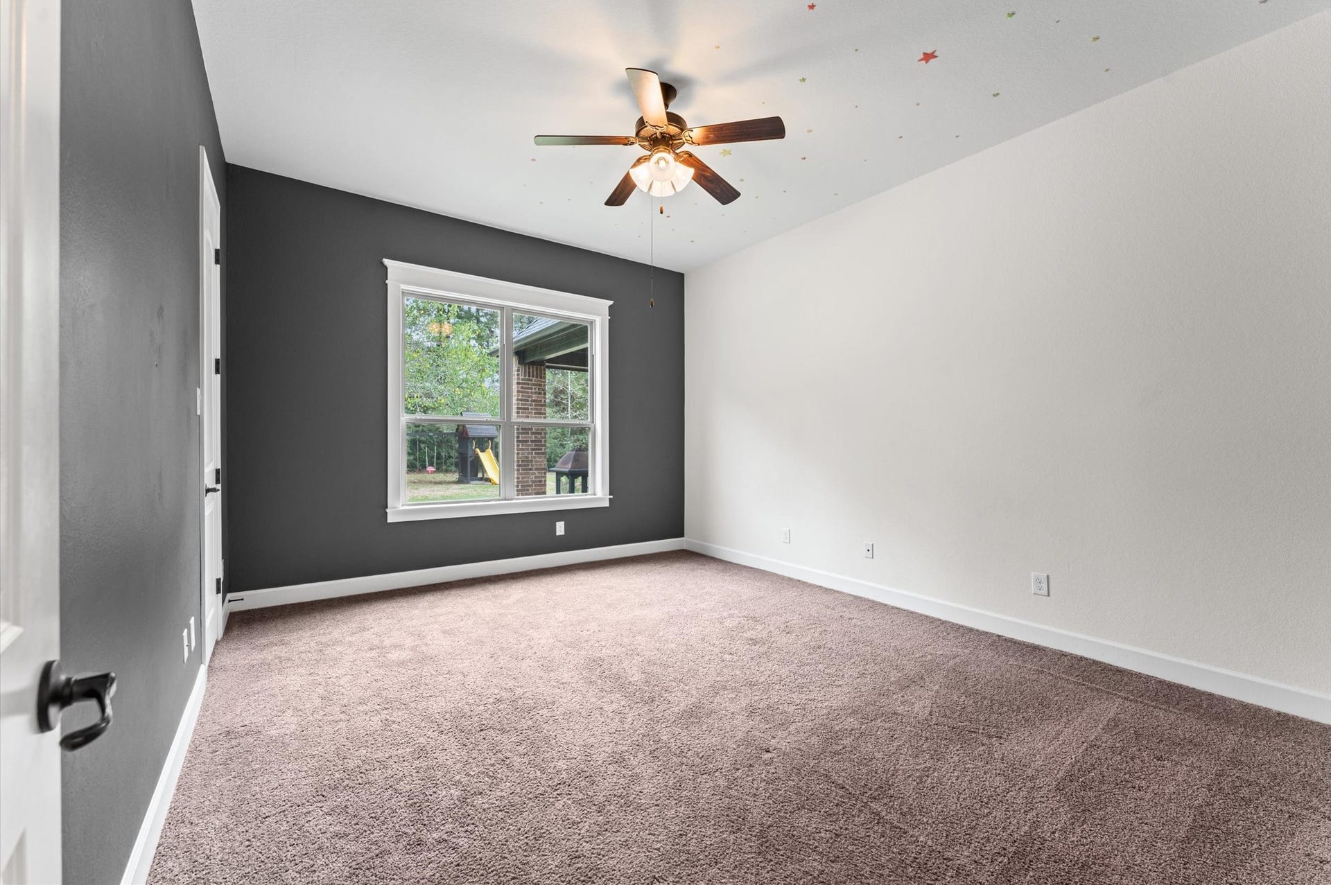 Spacious secondary bedrooms offer comfort and versatility, with beautiful views overlooking your private backyard retreat.