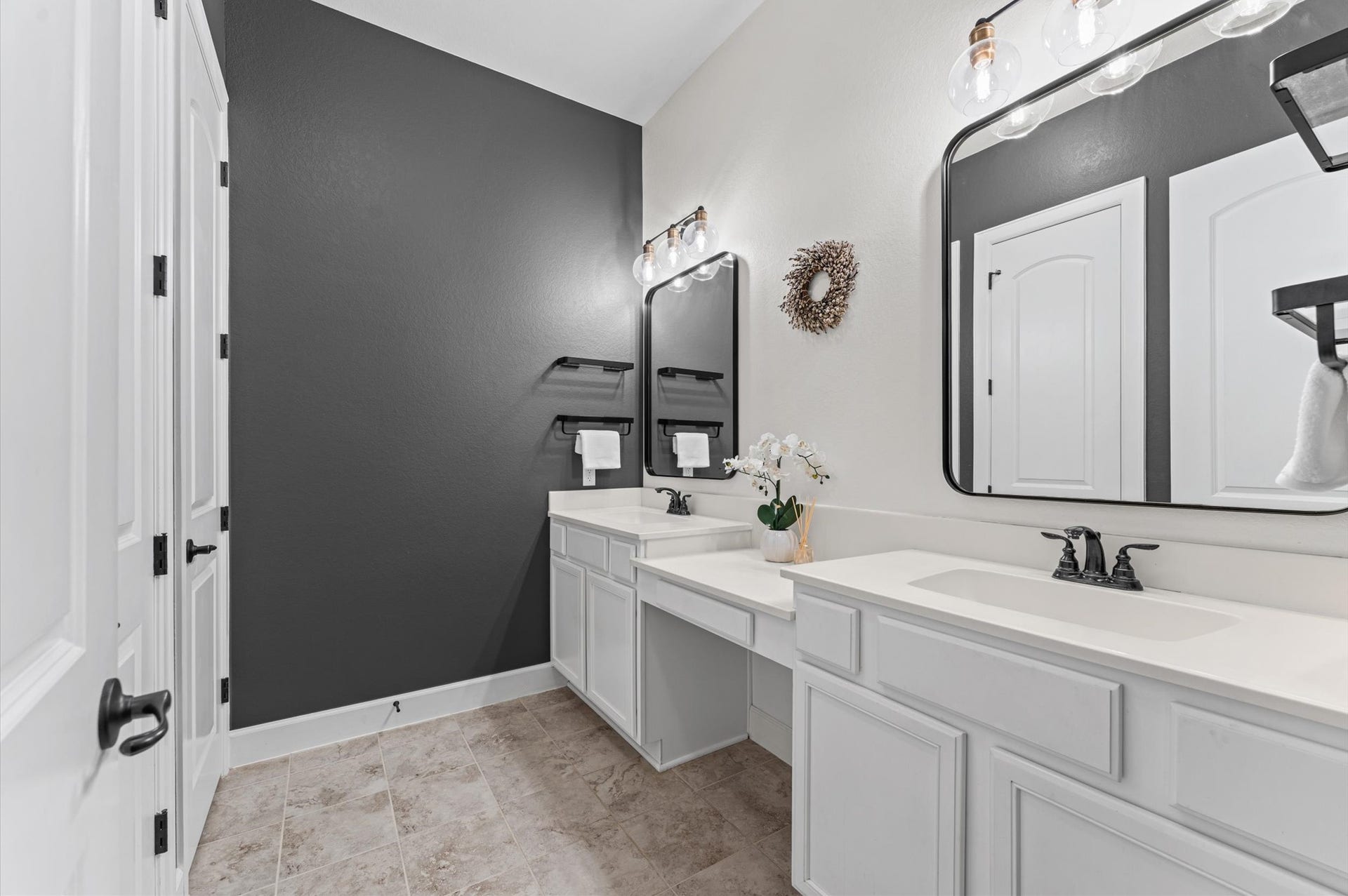 The spacious secondary bathroom features a double vanity with generous countertop space, offering both comfort and functionality for everyday living!