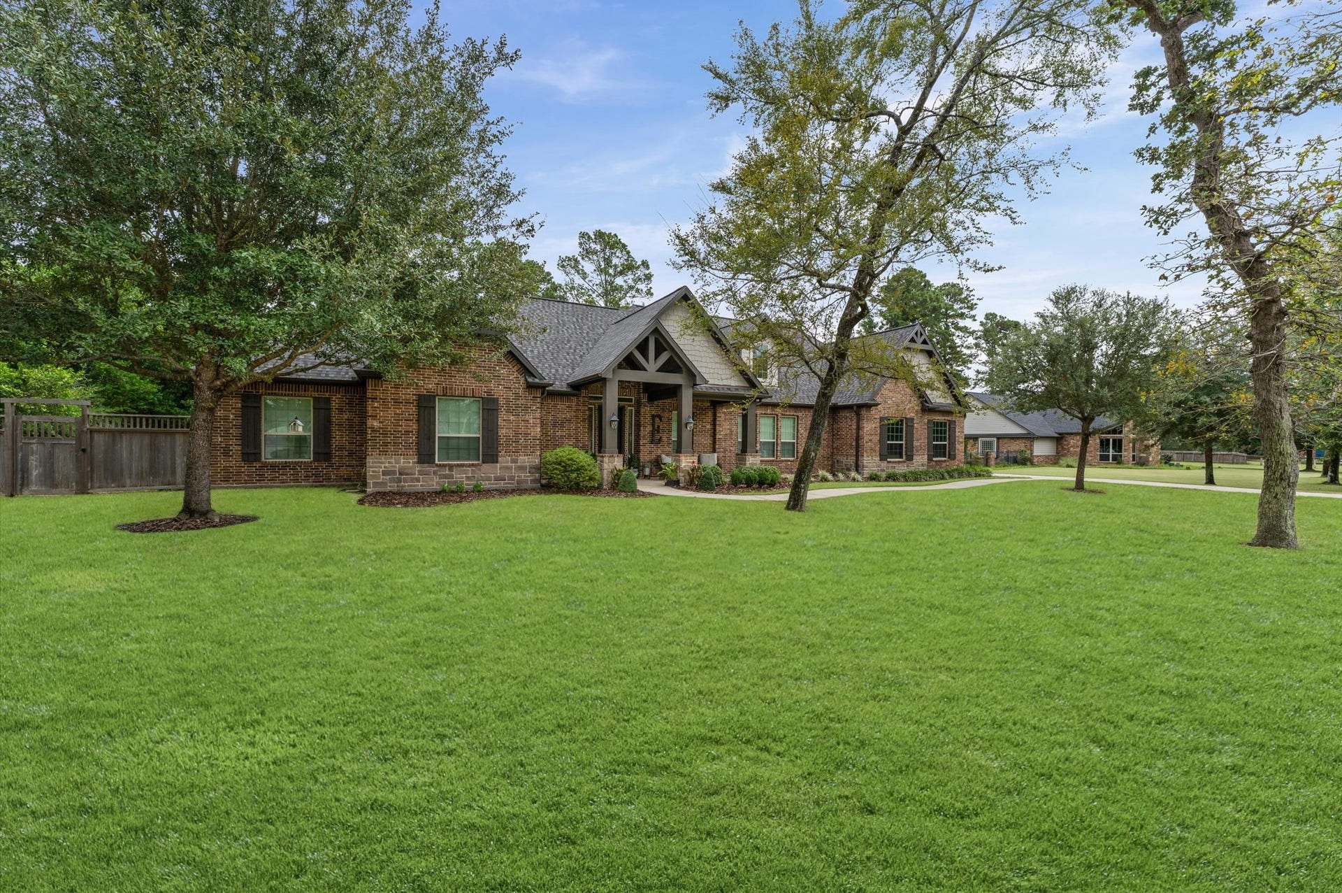 Mature trees and expansive frontage create a beautiful first impression while offering added privacy and a peaceful setting. Enjoy the perfect blend of space, natural beauty, and tranquility. Welcome to your new home!