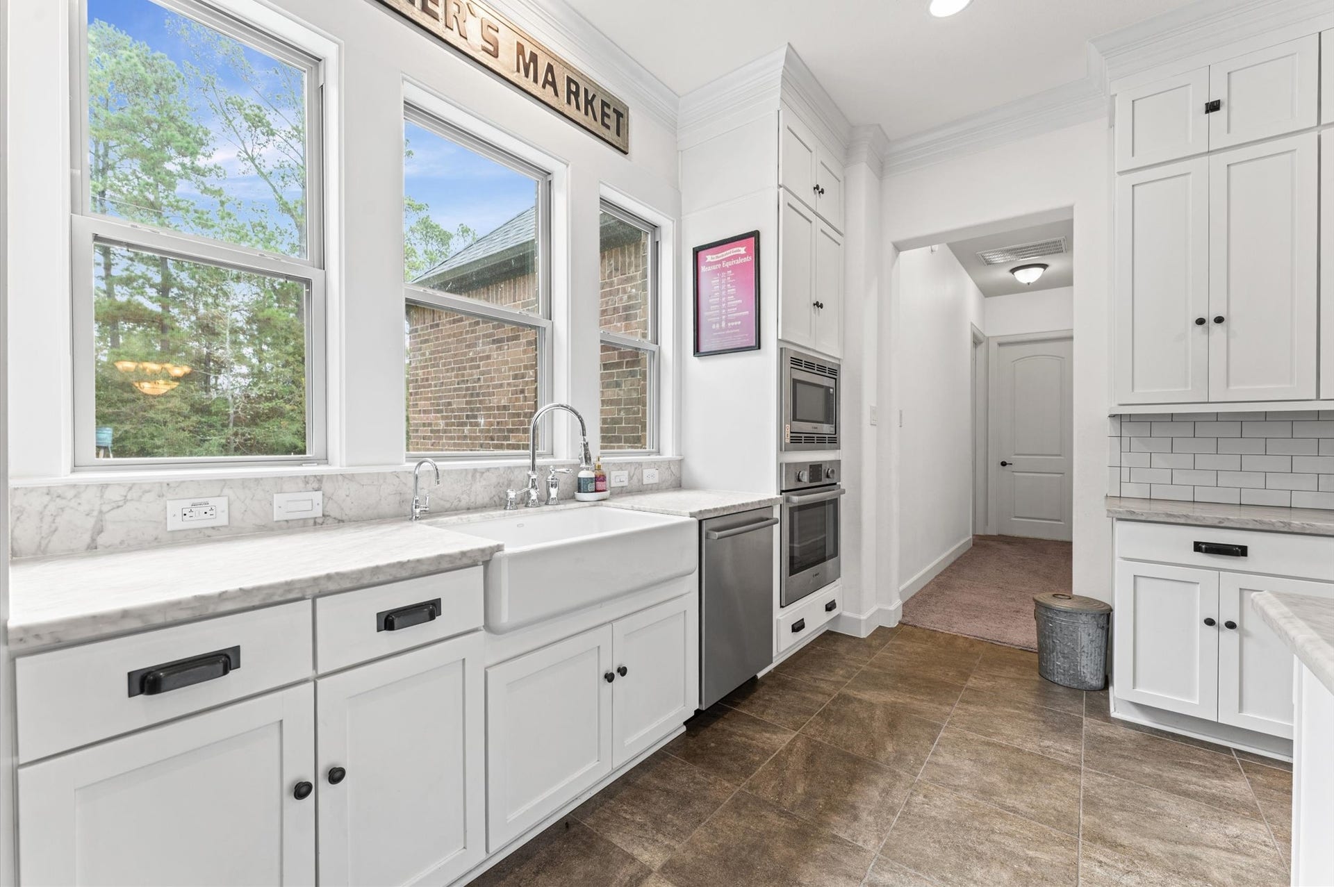 Enjoy peaceful backyard views from the spacious kitchen sink, overlooking your private retreat with no rear neighbors. The perfect blend of privacy, tranquility, and natural beauty!
